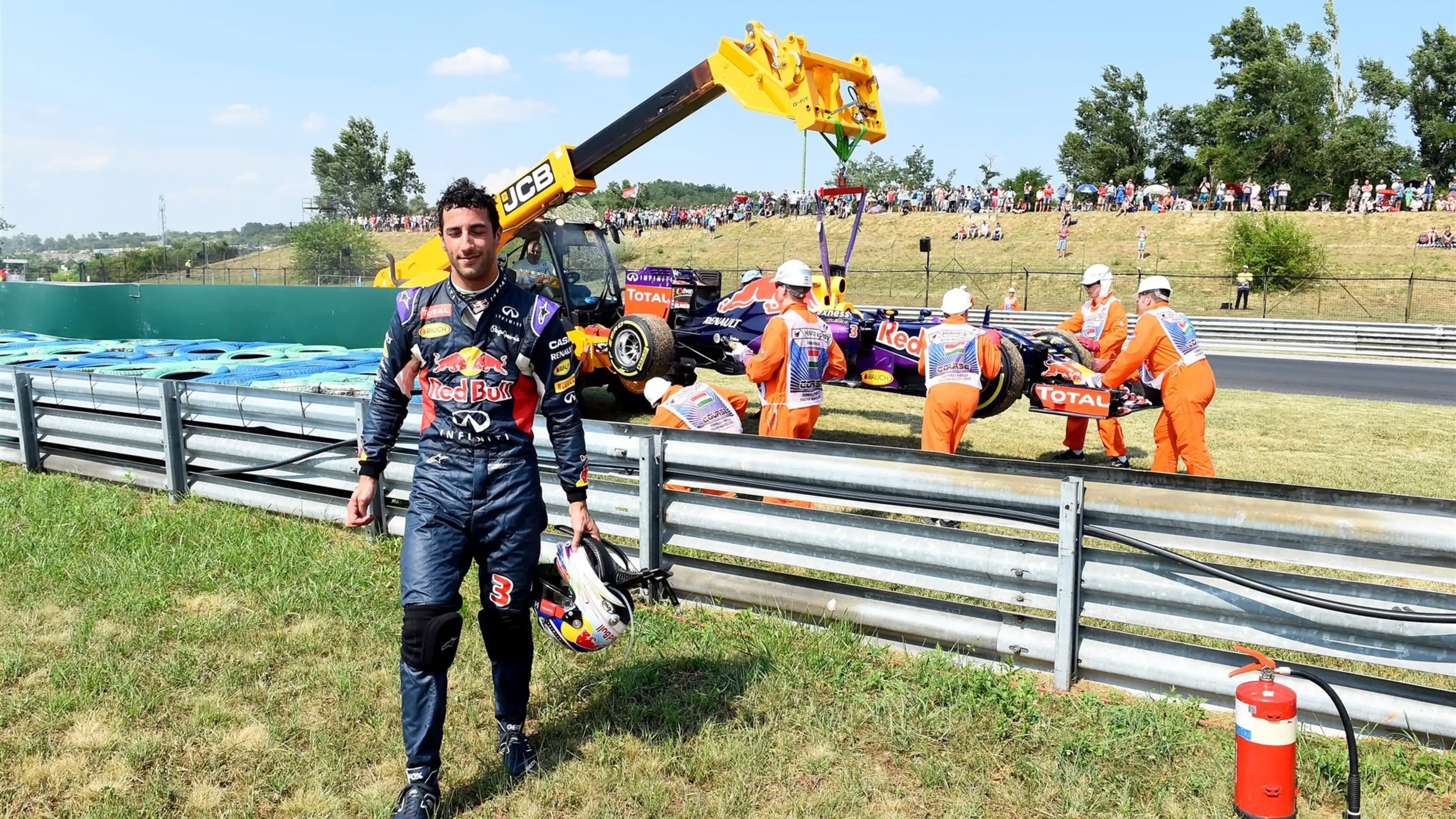 The Red Bull Racing RB11 car of Daniel Ricciardo (AUS) Red Bull Racing is recovered after suffering