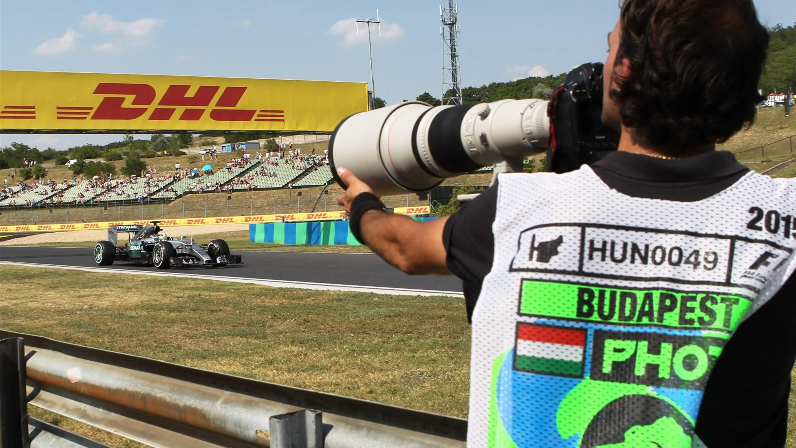 Lewis Hamilton (GBR) Mercedes AMG F1 W06 and photographer at Formula One World Championship, Rd10,