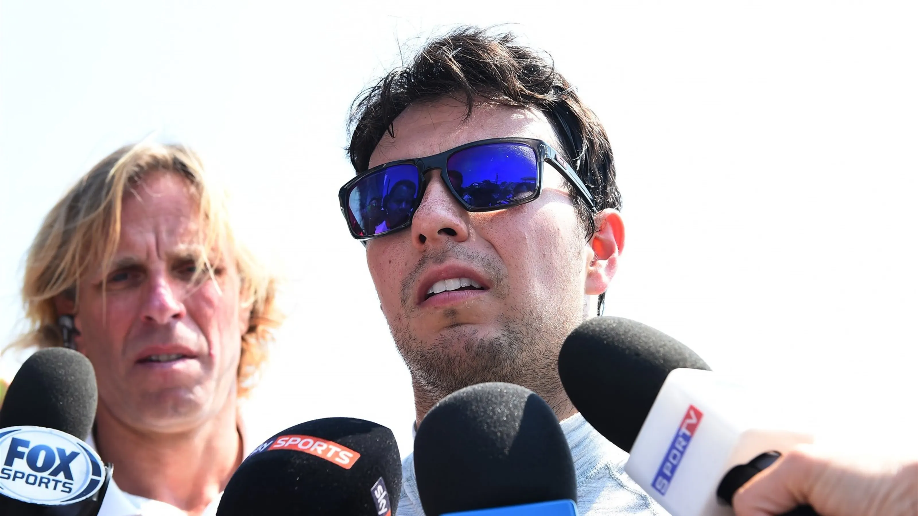 Sergio Perez (MEX) Force India talks with the media after crashing and rolling in FP1 at Formula
