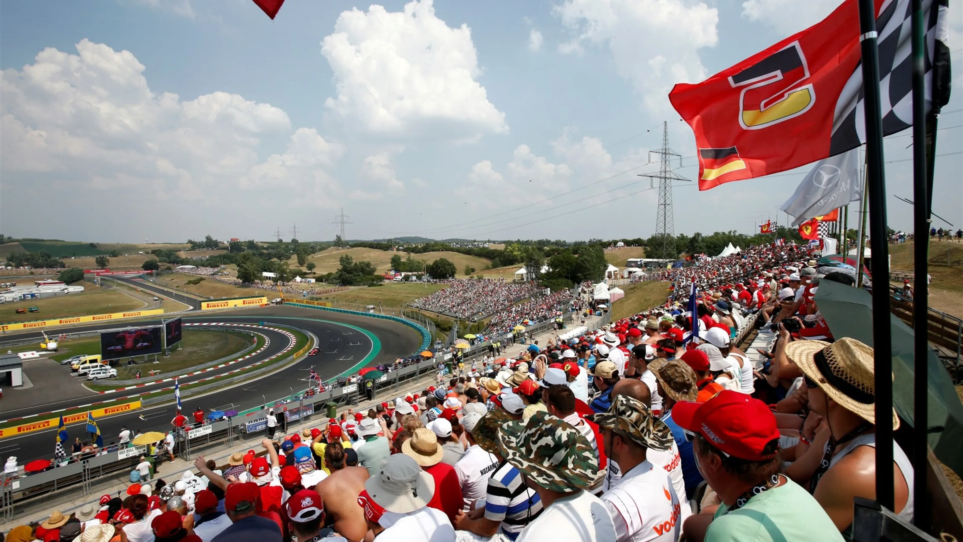Kimi Raikkonen (FIN) Ferrari SF15-T passes Ferrari fans and flags at Formula One World