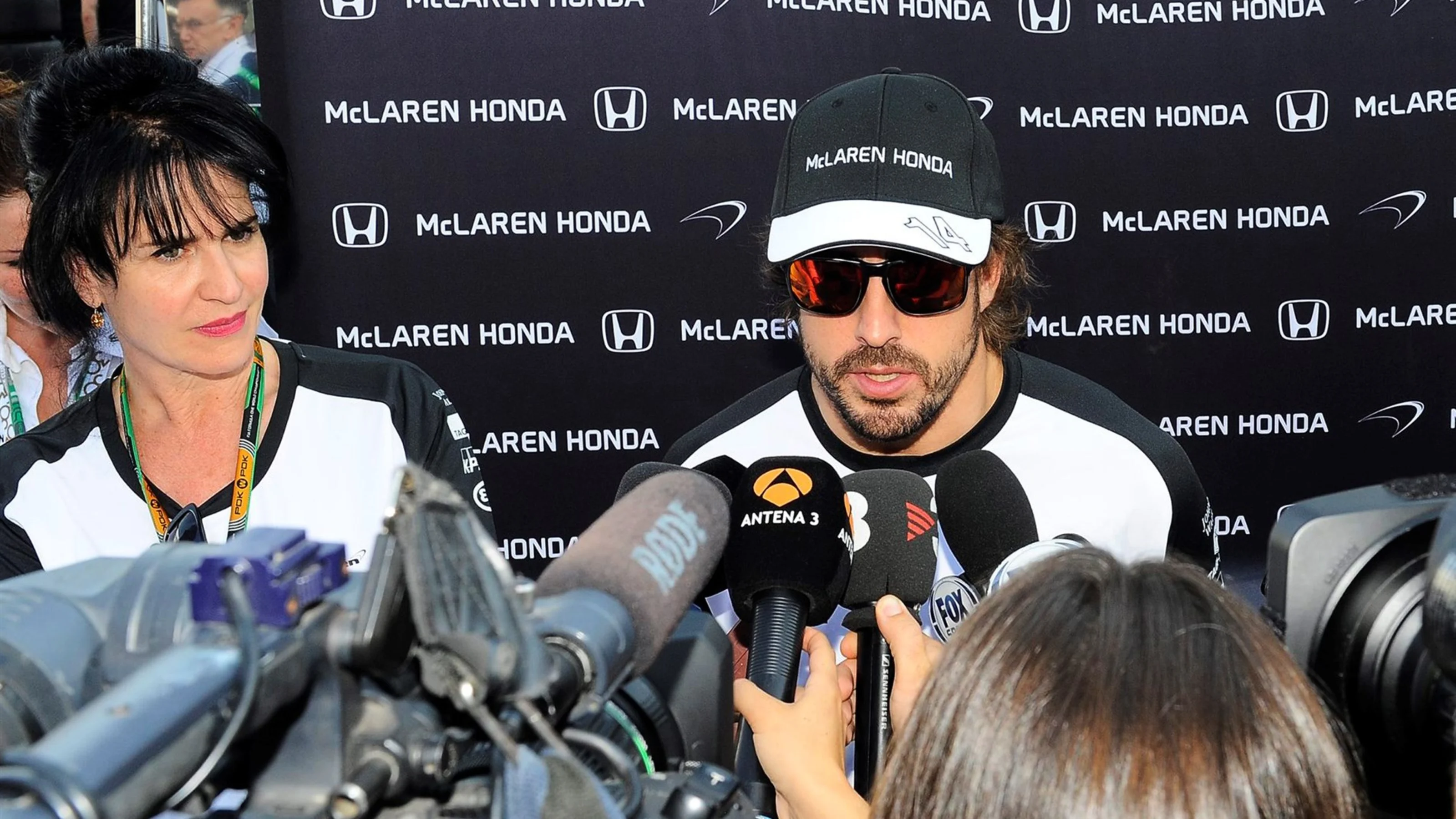 Fernando Alonso (ESP) McLaren talks with the media as Silvia Hoffer Frangipane, McLaren Press