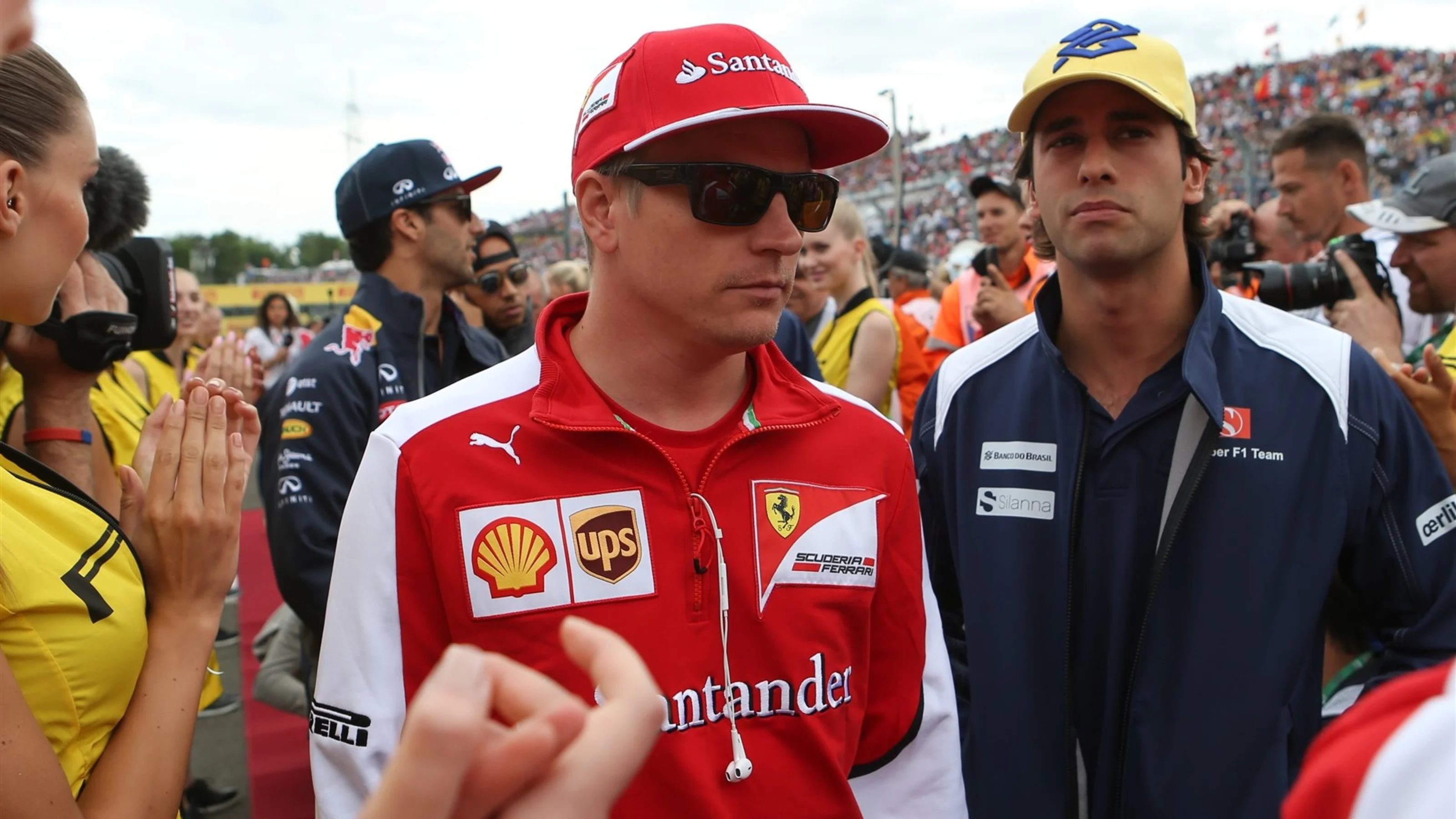 Kimi Raikkonen (FIN) Ferrari and Felipe Nasr (BRA) Sauber on the drivers parade at Formula One