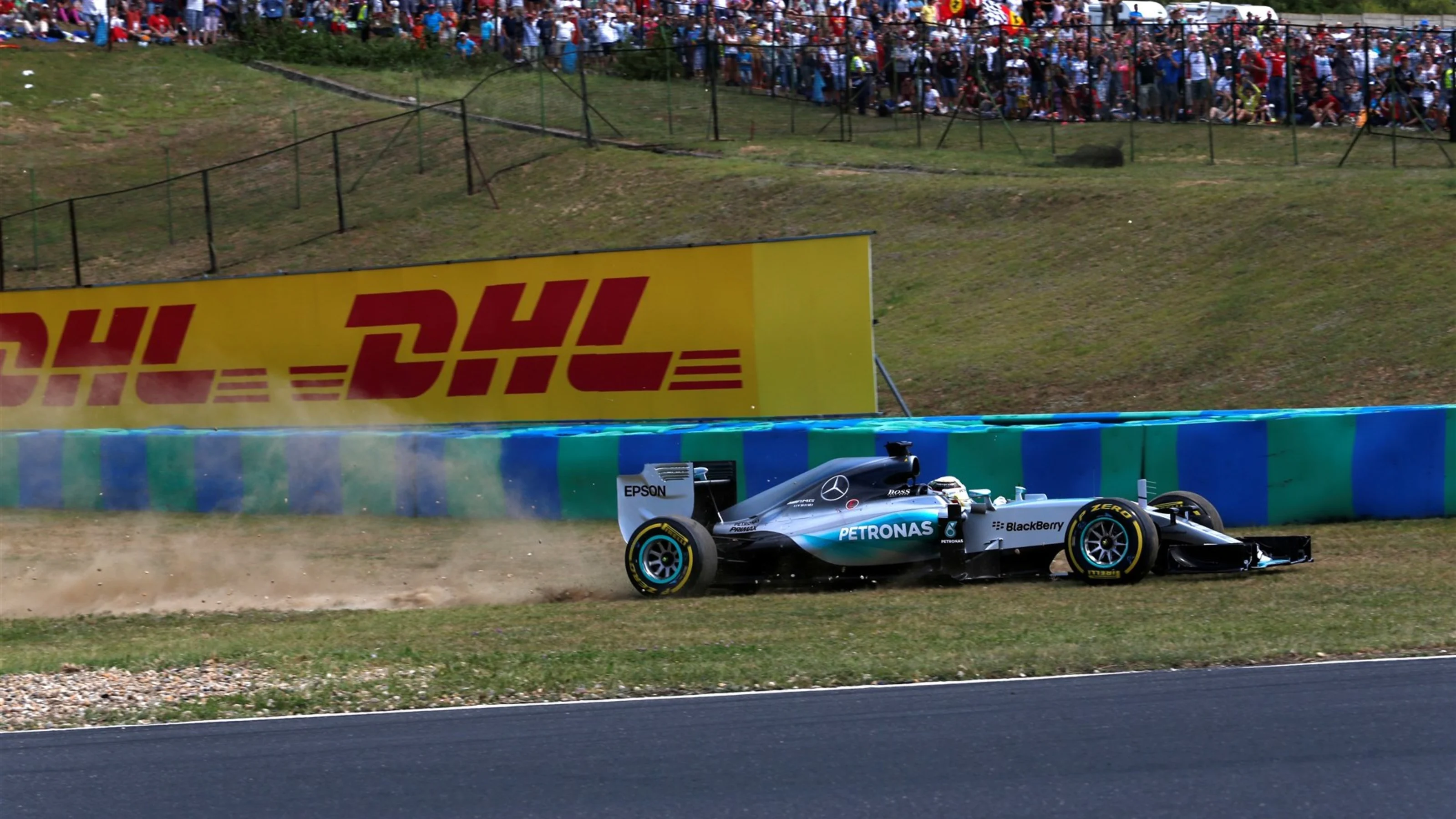 Lewis Hamilton (GBR) Mercedes AMG F1 W06 goes through the gravel on lap 1 at Formula One World