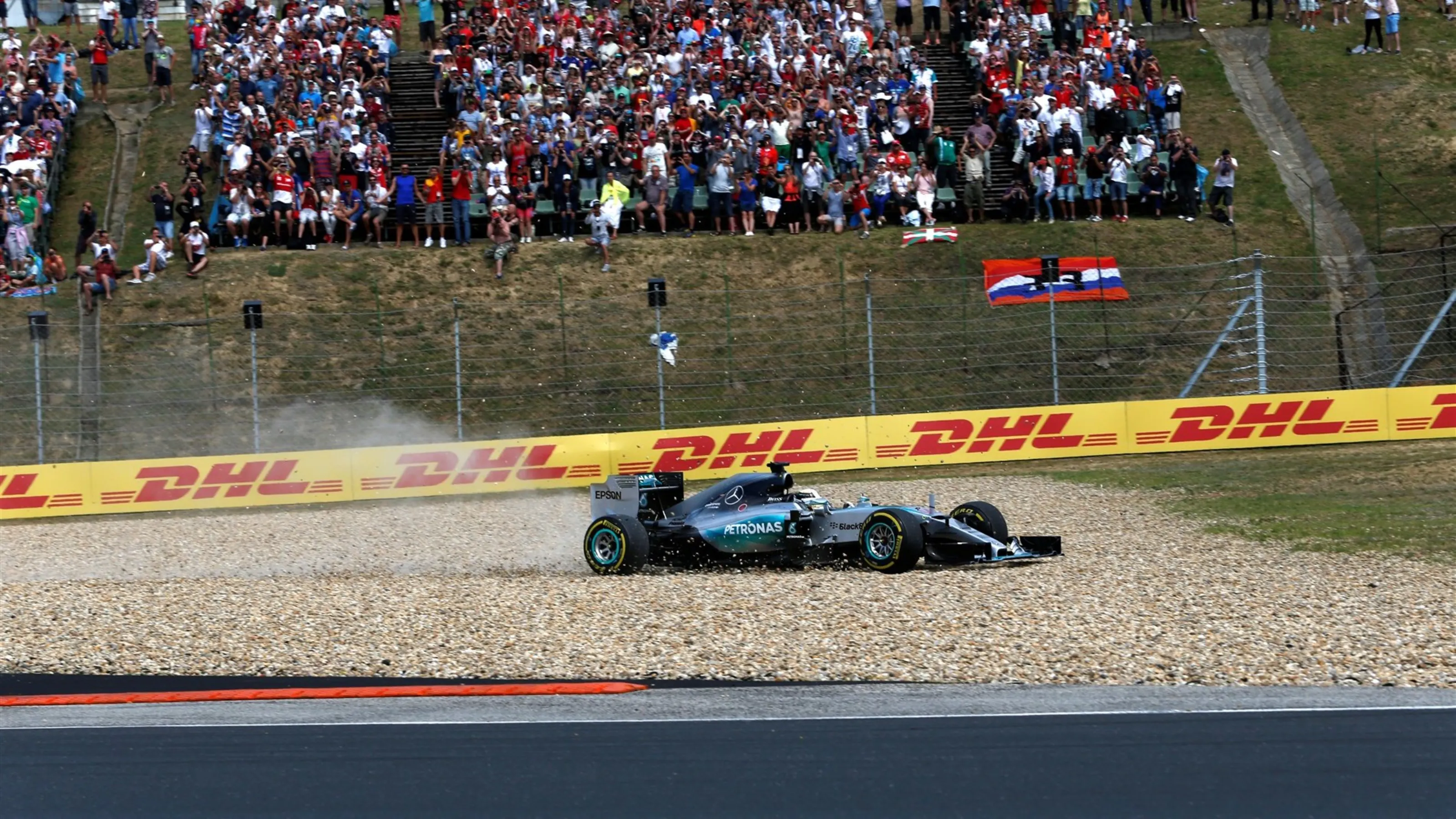Lewis Hamilton (GBR) Mercedes AMG F1 W06 goes through the gravel on lap 1 at Formula One World