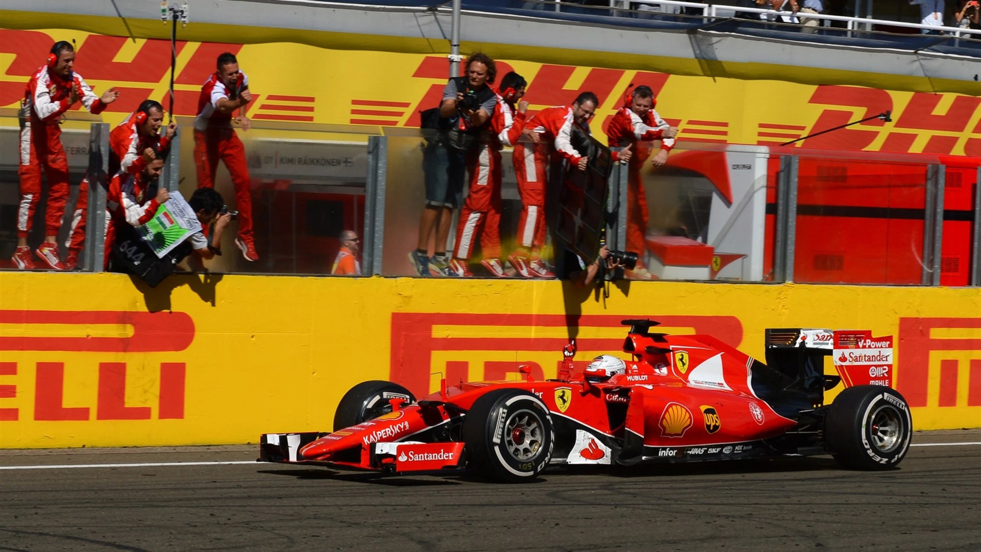 Sebastian Vettel (GER) Ferrari SF15-T crosses the line to win at Formula One World Championship,