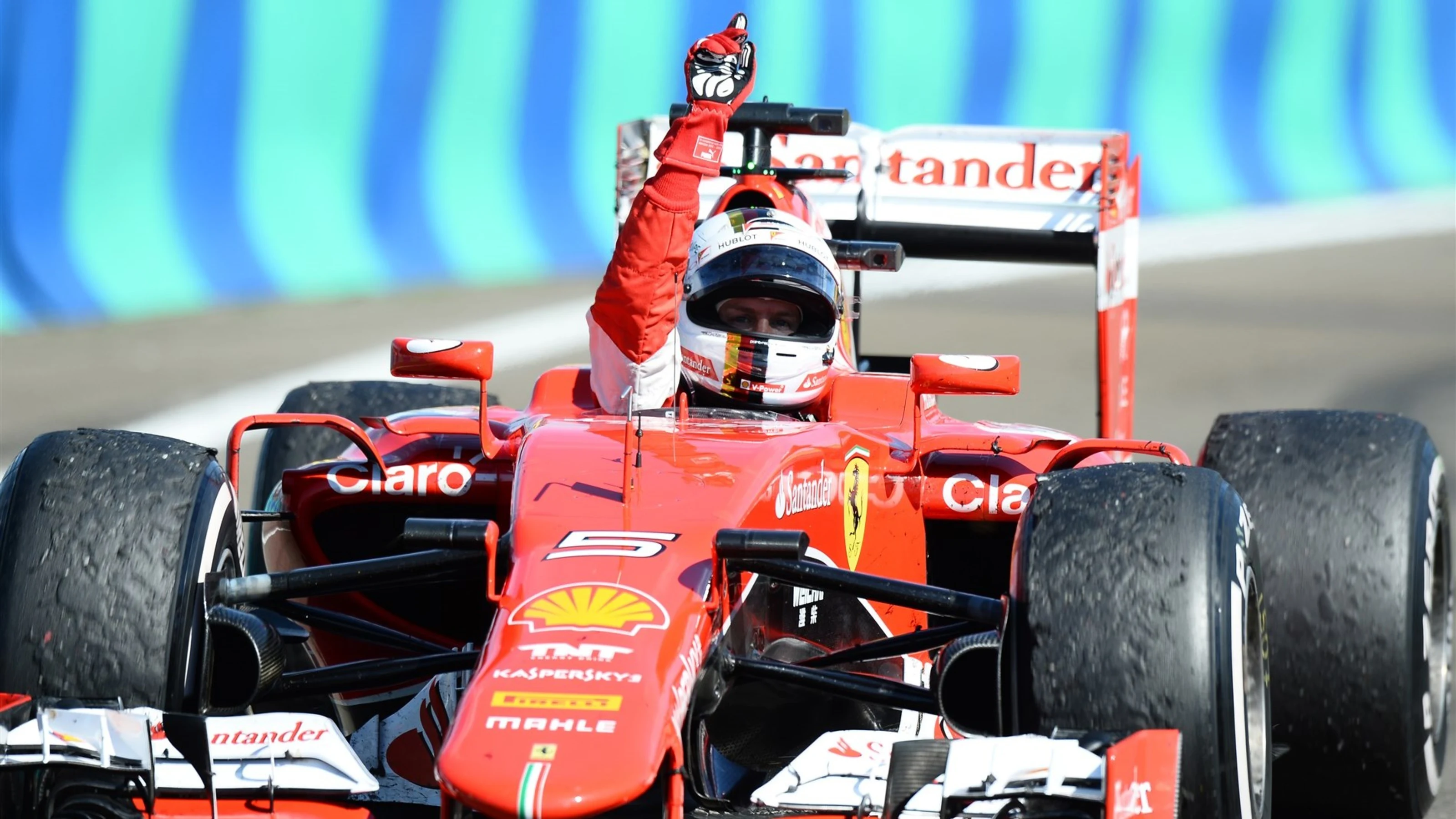 Sebastian Vettel (GER) Ferrari SF15-T celebrates at Formula One World Championship, Rd10, Hungarian