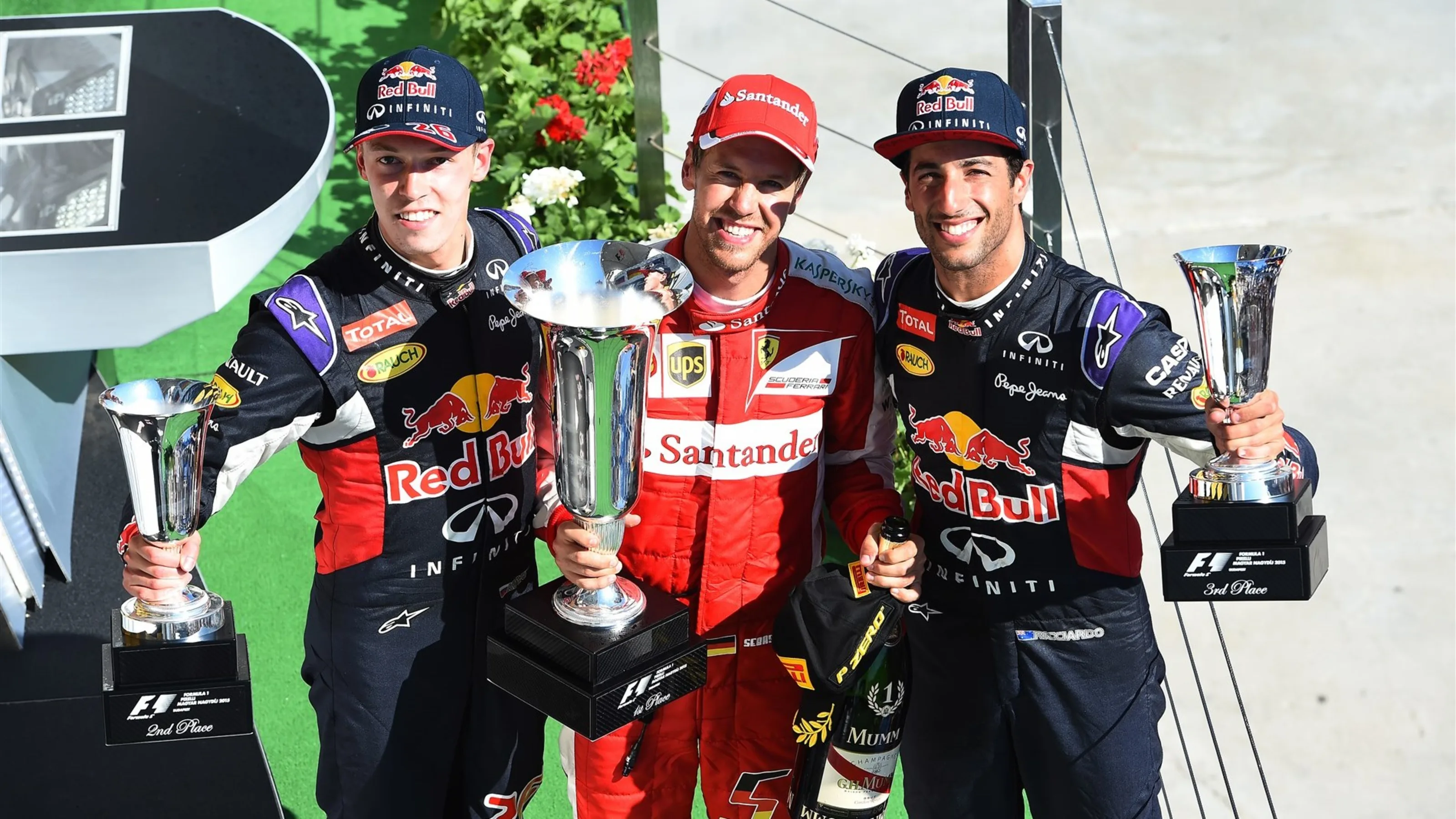 Daniil Kyvat (RUS) Red Bull Racing, race winner Sebastian Vettel (GER) Ferrari and Daniel Ricciardo
