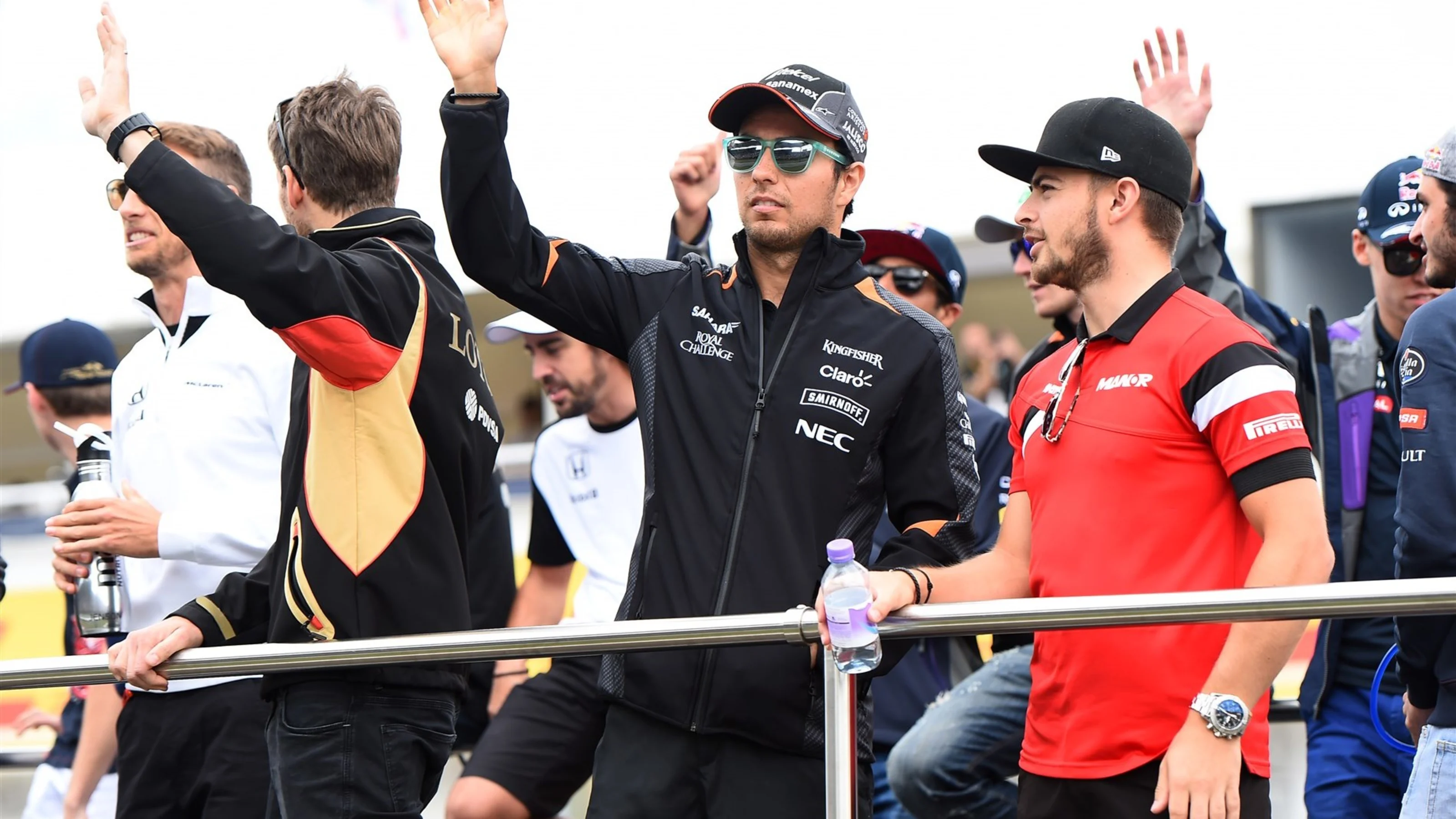 Sergio Perez (MEX) Force India and Will Stevens (GBR) Manor GP on the drivers parade at Formula One