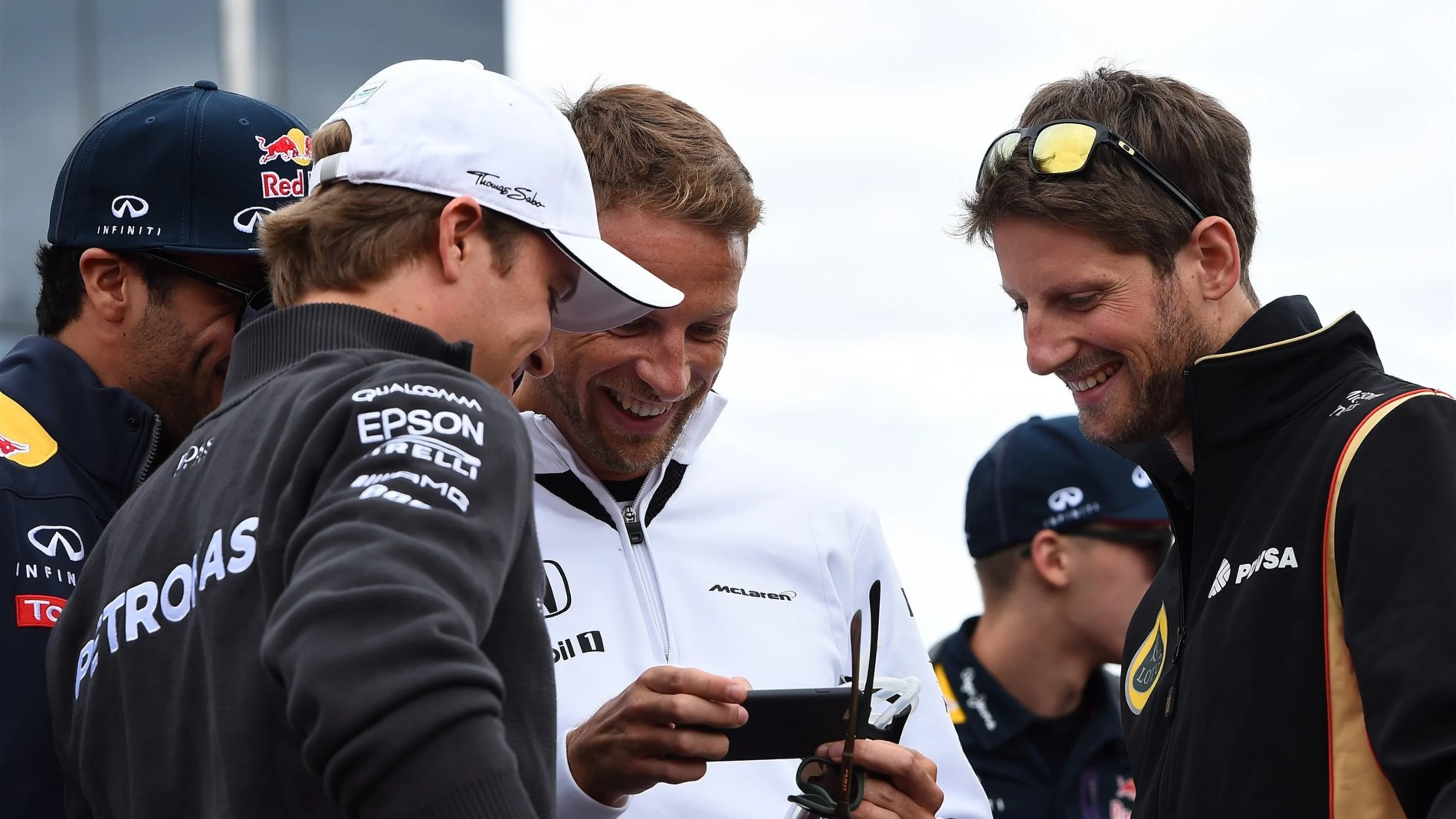 Nico Rosberg (GER) Mercedes AMG F1, Jenson Button (GBR) McLaren and Romain Grosjean (FRA) Lotus F1