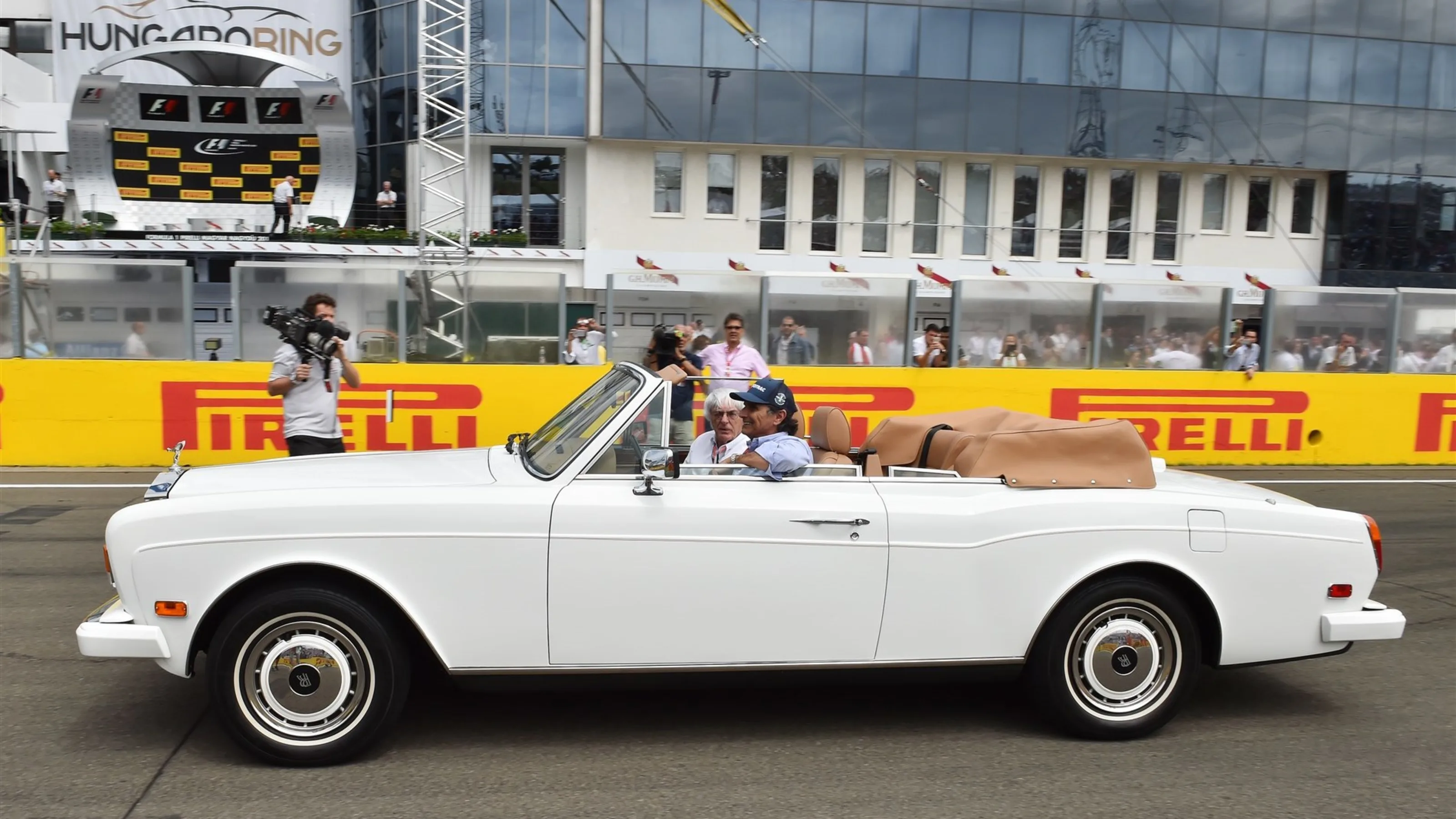 Nelson Piquet (BRA) and Bernie Ecclestone (GBR) CEO Formula One Group (FOM) in a Rolls Royce on the