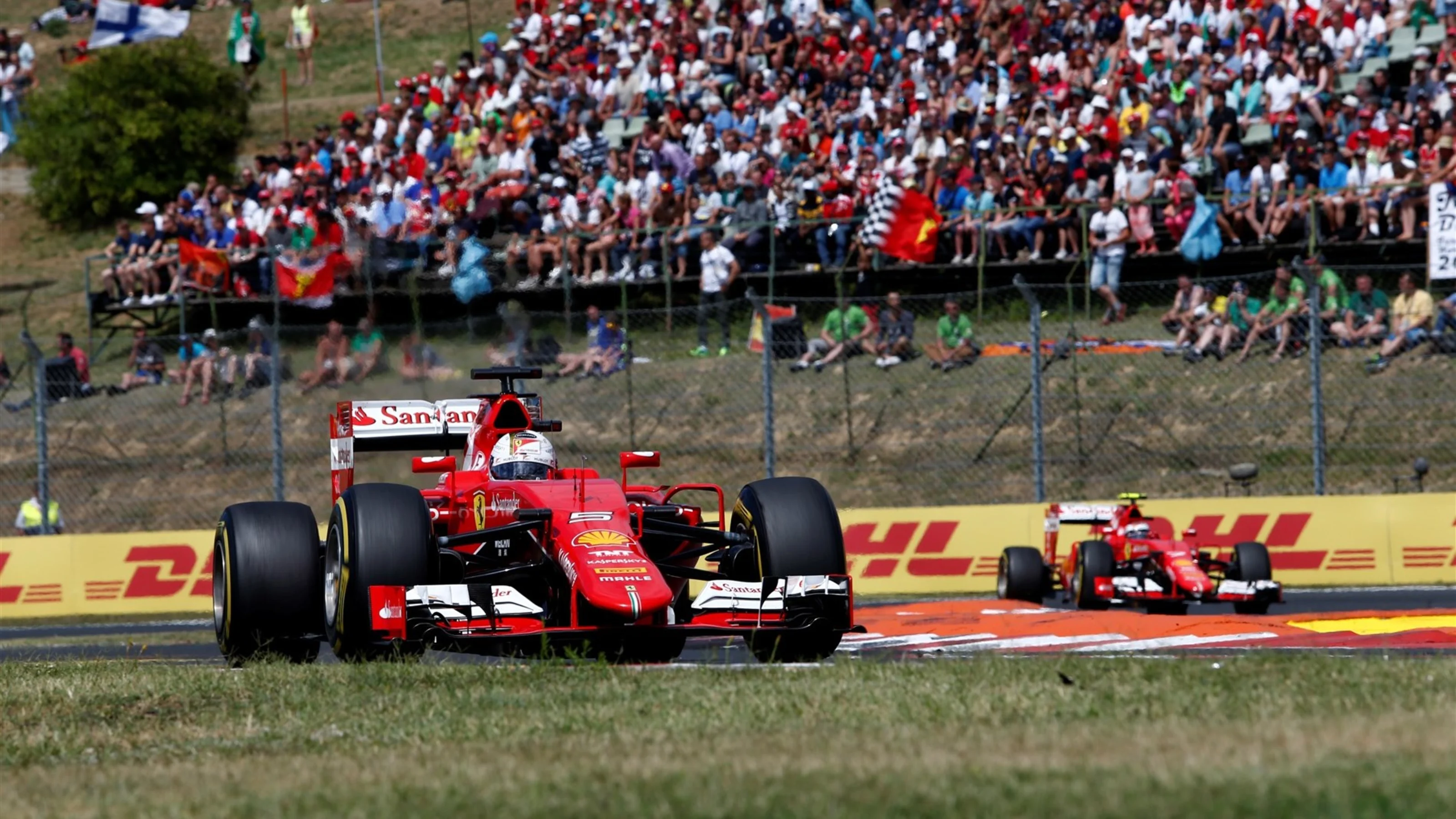 Sebastian Vettel (GER) Ferrari SF15-T leads Kimi Raikkonen (FIN) Ferrari SF15-T at Formula One