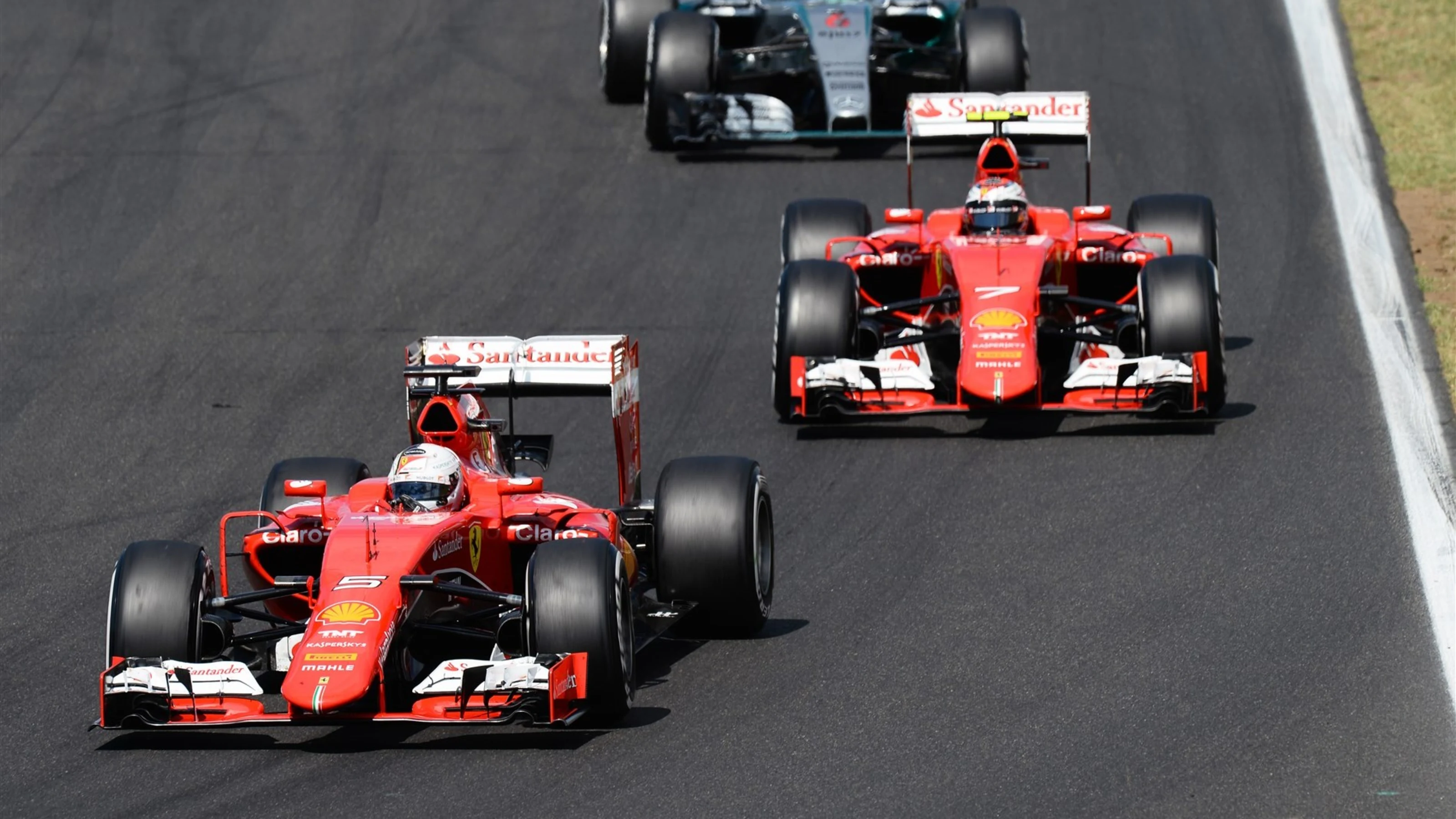 Sebastian Vettel (GER) Ferrari SF15-T leads Kimi Raikkonen (FIN) Ferrari SF15-T at Formula One