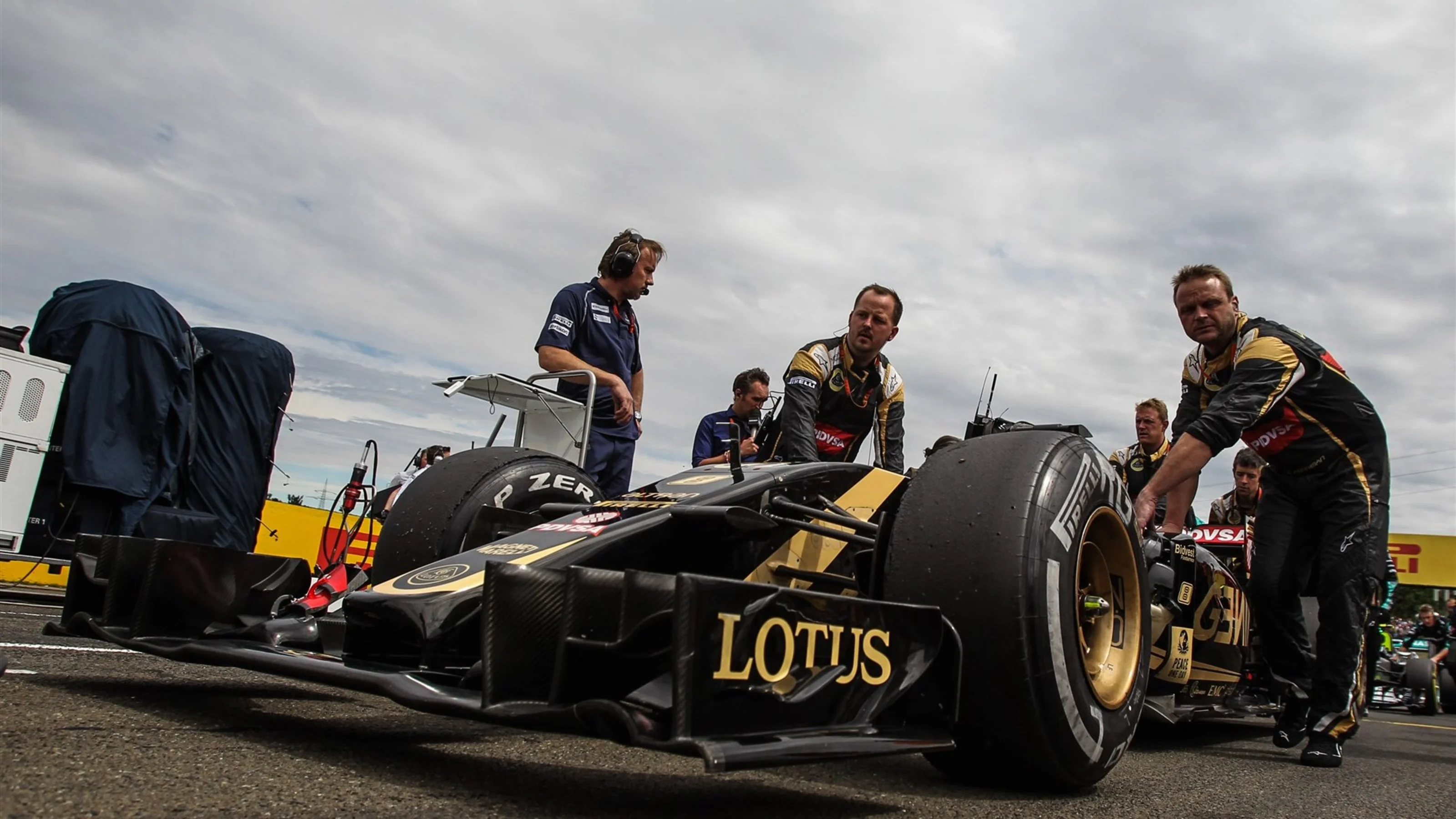 Romain Grosjean (FRA) Lotus E23 Hybrid on the grid at Formula One World Championship, Rd10,