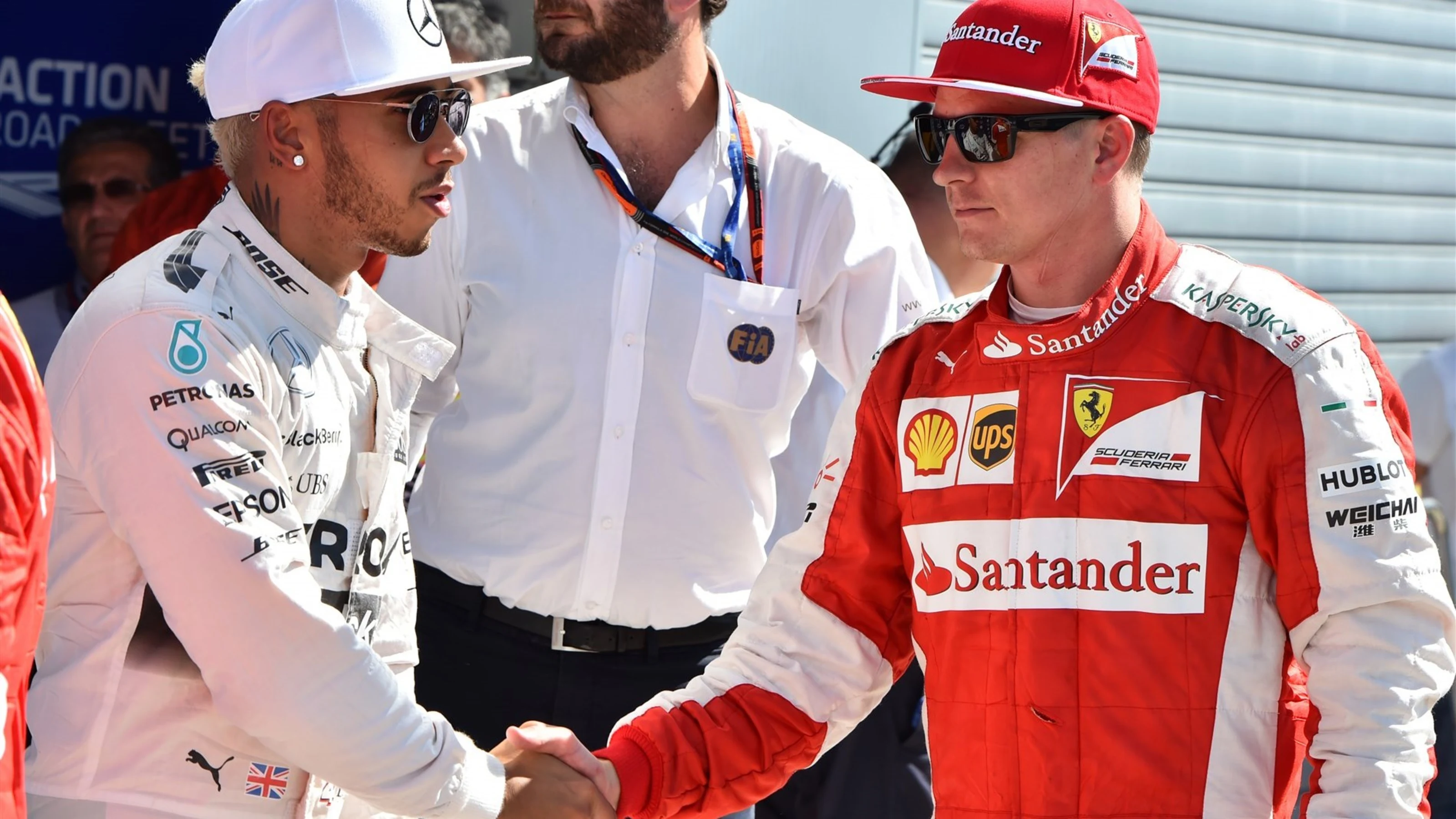 Pole sitter Lewis Hamilton (GBR) Mercedes AMG F1 and Kimi Raikkonen (FIN) Ferrari celebrate in parc