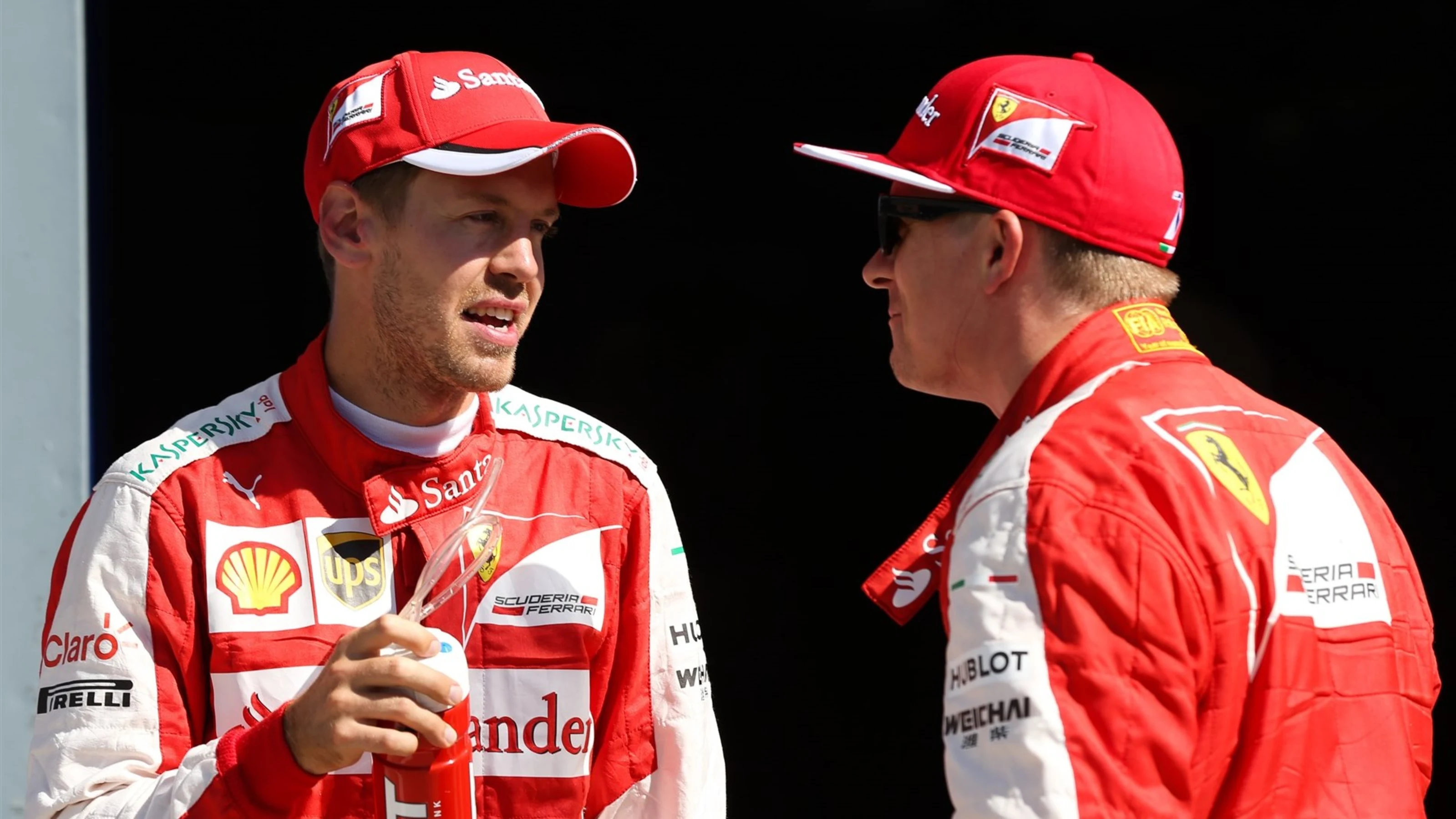 Sebastian Vettel (GER) Ferrari and Kimi Raikkonen (FIN) Ferrari celebrates in parc ferme at Formula