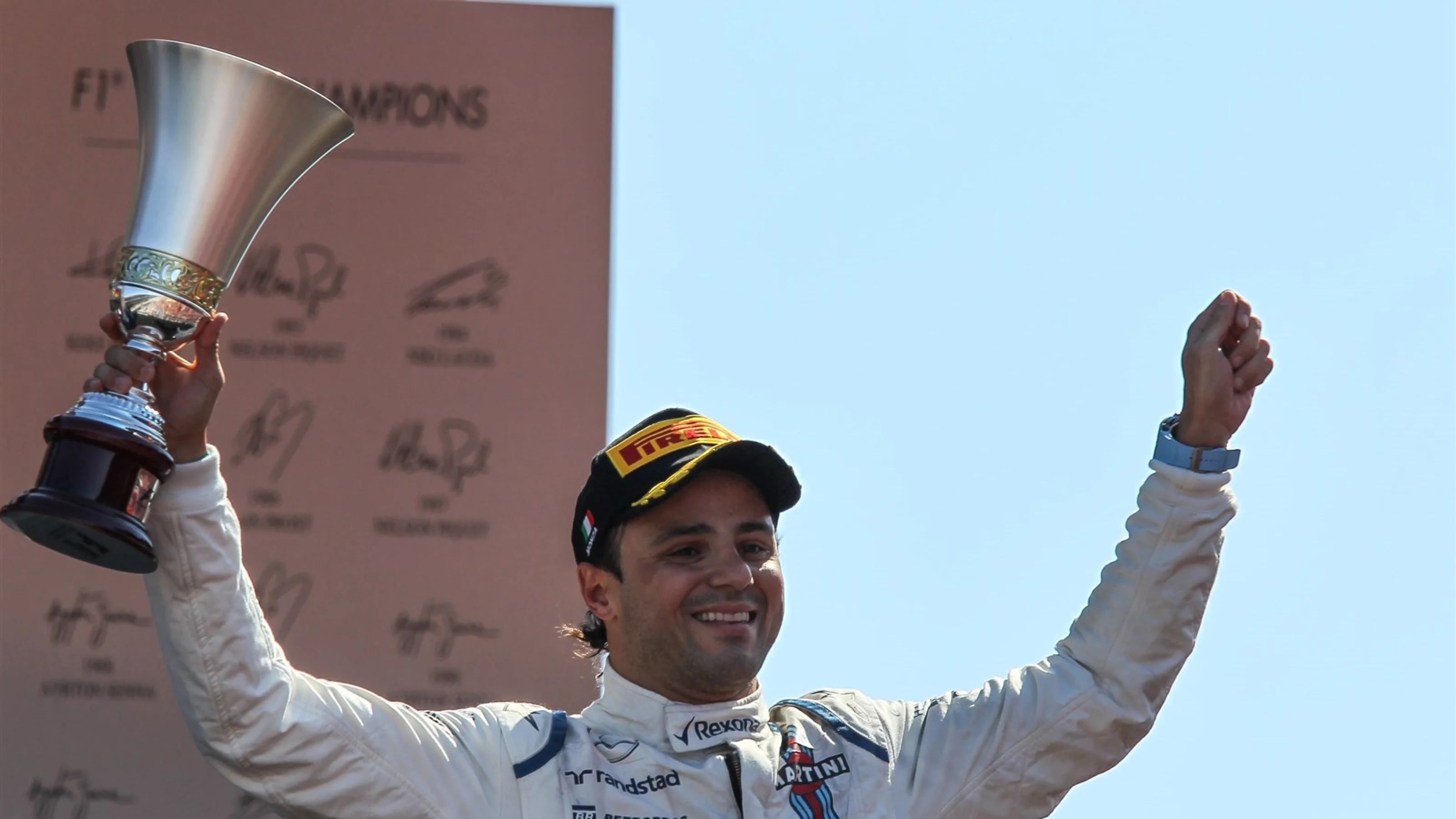 Felipe Massa (BRA) Williams celebrates with the trophy on the podium at Formula One World
