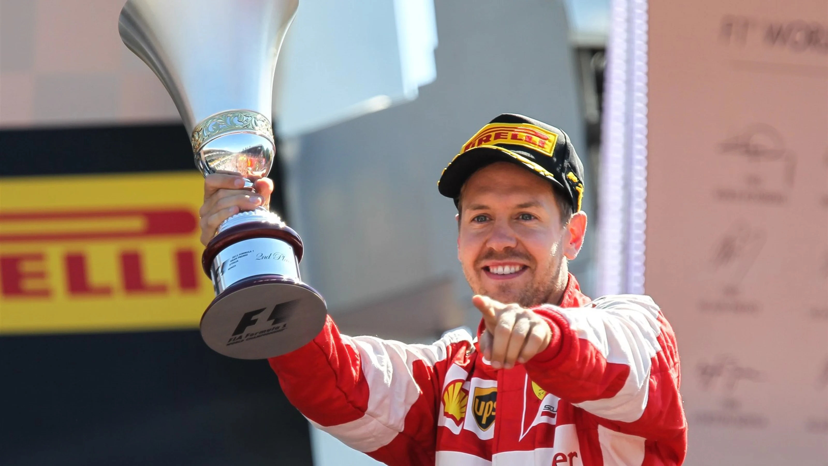 Sebastian Vettel (GER) Ferrari celebrates with the trophy on the podium at Formula One World
