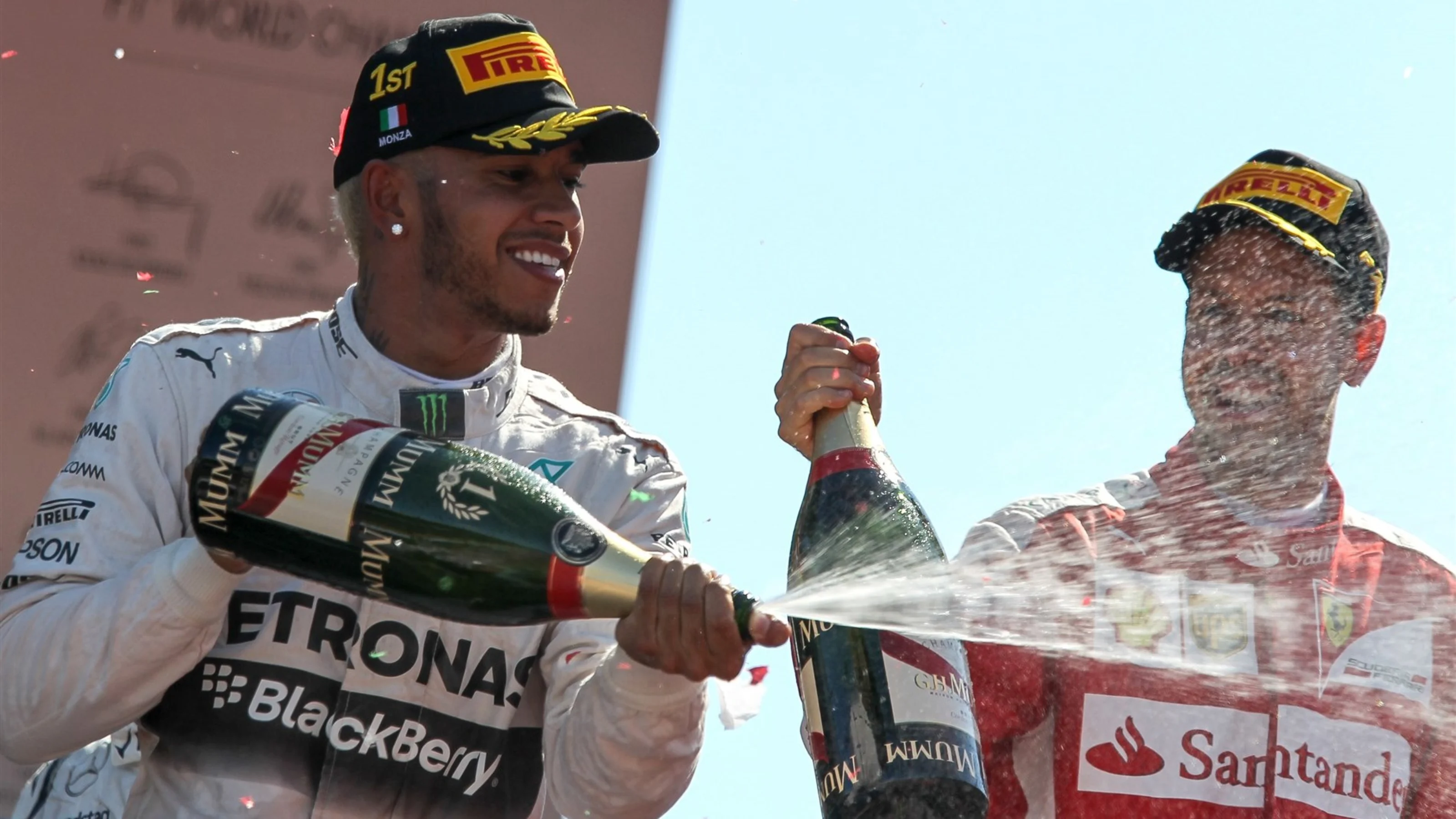 Race winner Lewis Hamilton (GBR) Mercedes AMG F1 celebrates with champagne on the podium at Formula