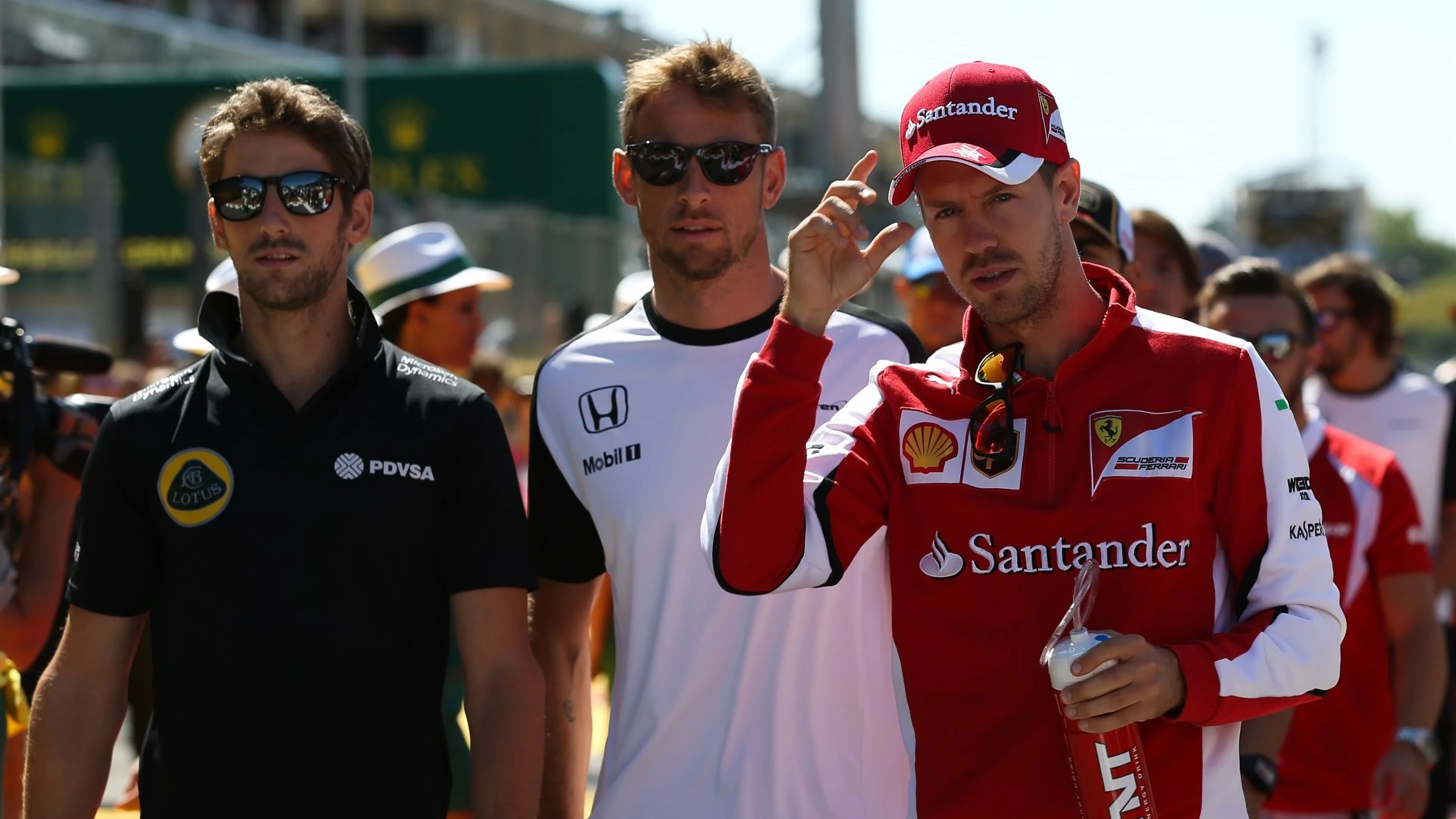 Romain Grosjean (FRA) Lotus F1, Jenson Button (GBR) McLaren and Sebastian Vettel (GER) Ferrari on
