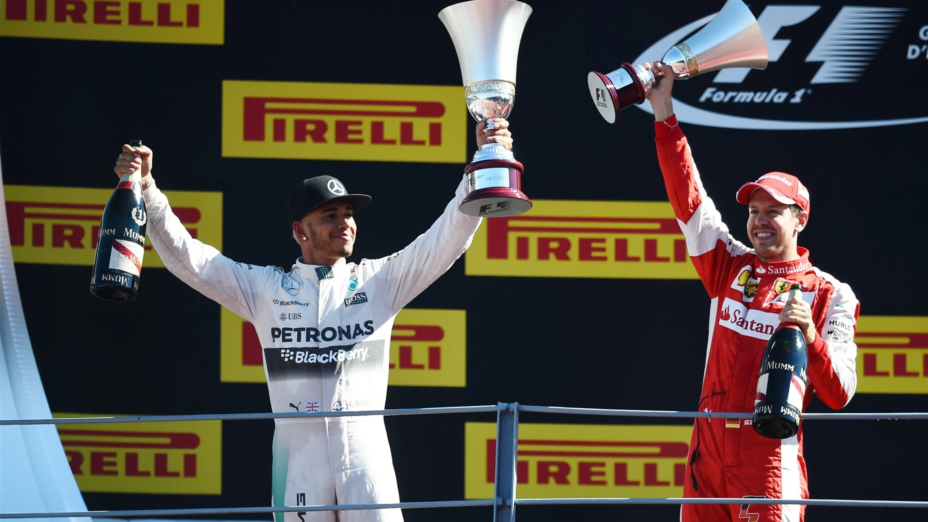 Race winner Lewis Hamilton (GBR) Mercedes AMG F1 and Sebastian Vettel (GER) Ferrari celebrate on