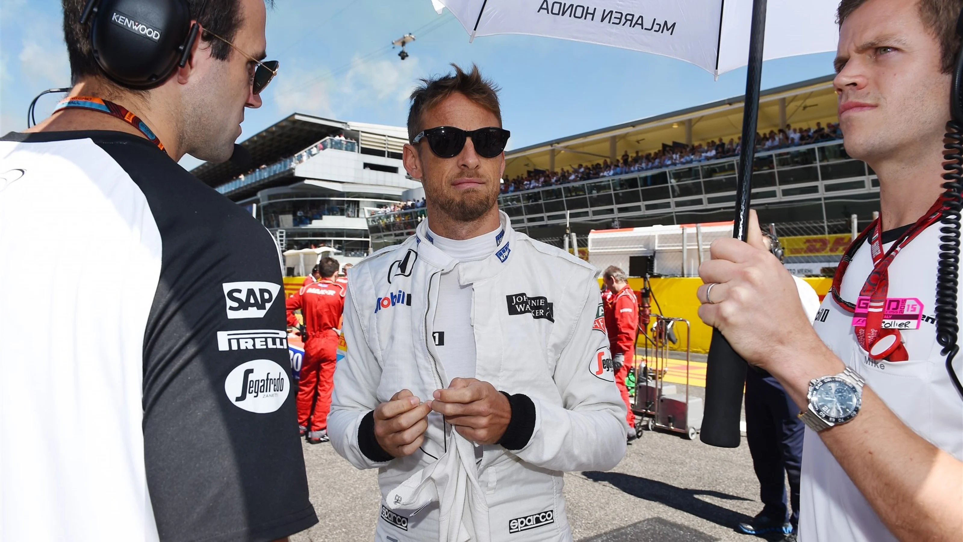 Jenson Button (GBR) McLaren on the grid with his trainer Mike Collier at Formula One World