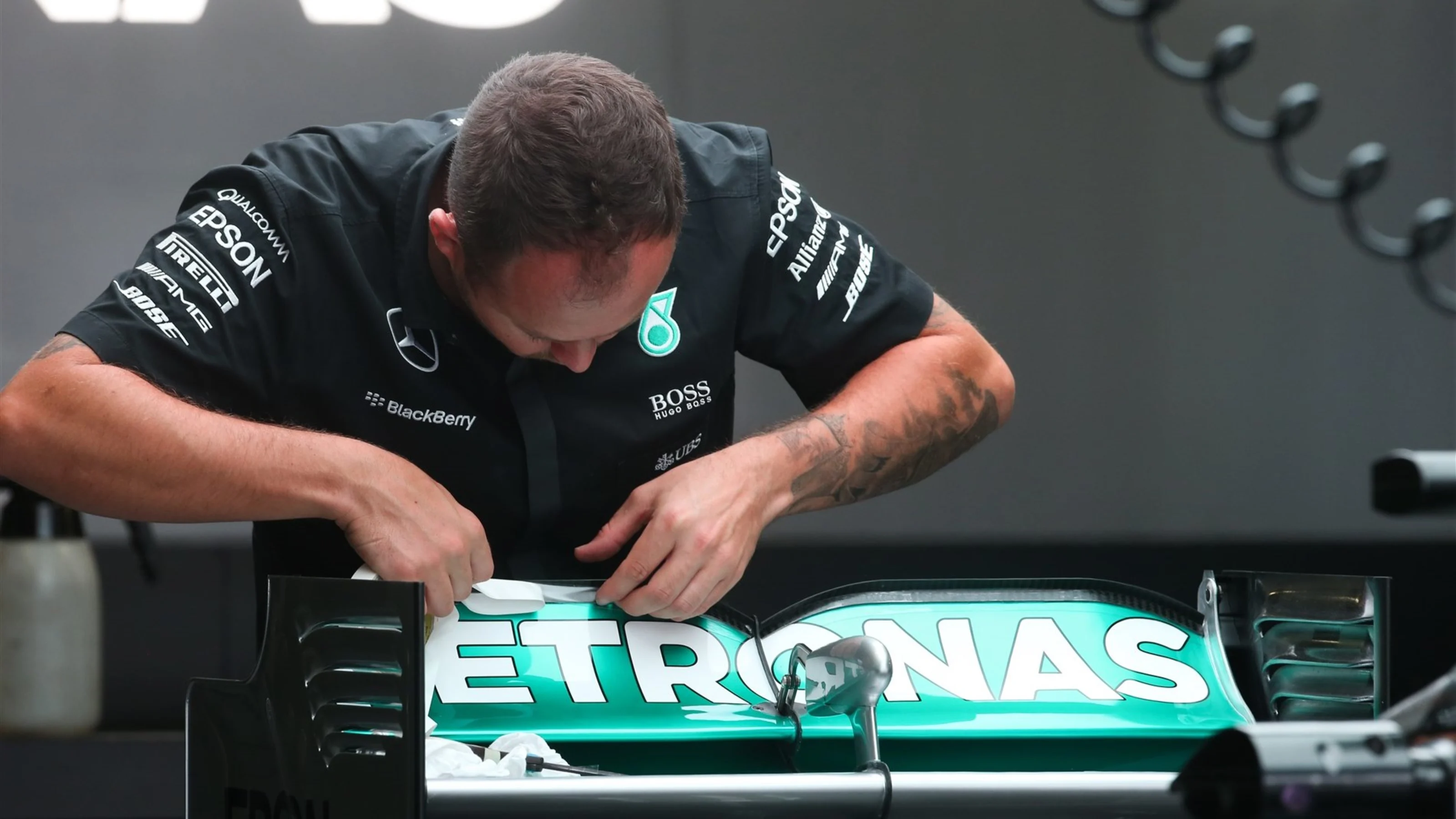 Mercedes mechanic works on Mercedes AMG F1 W06 rear wing at Formula One World Championship, Rd14,