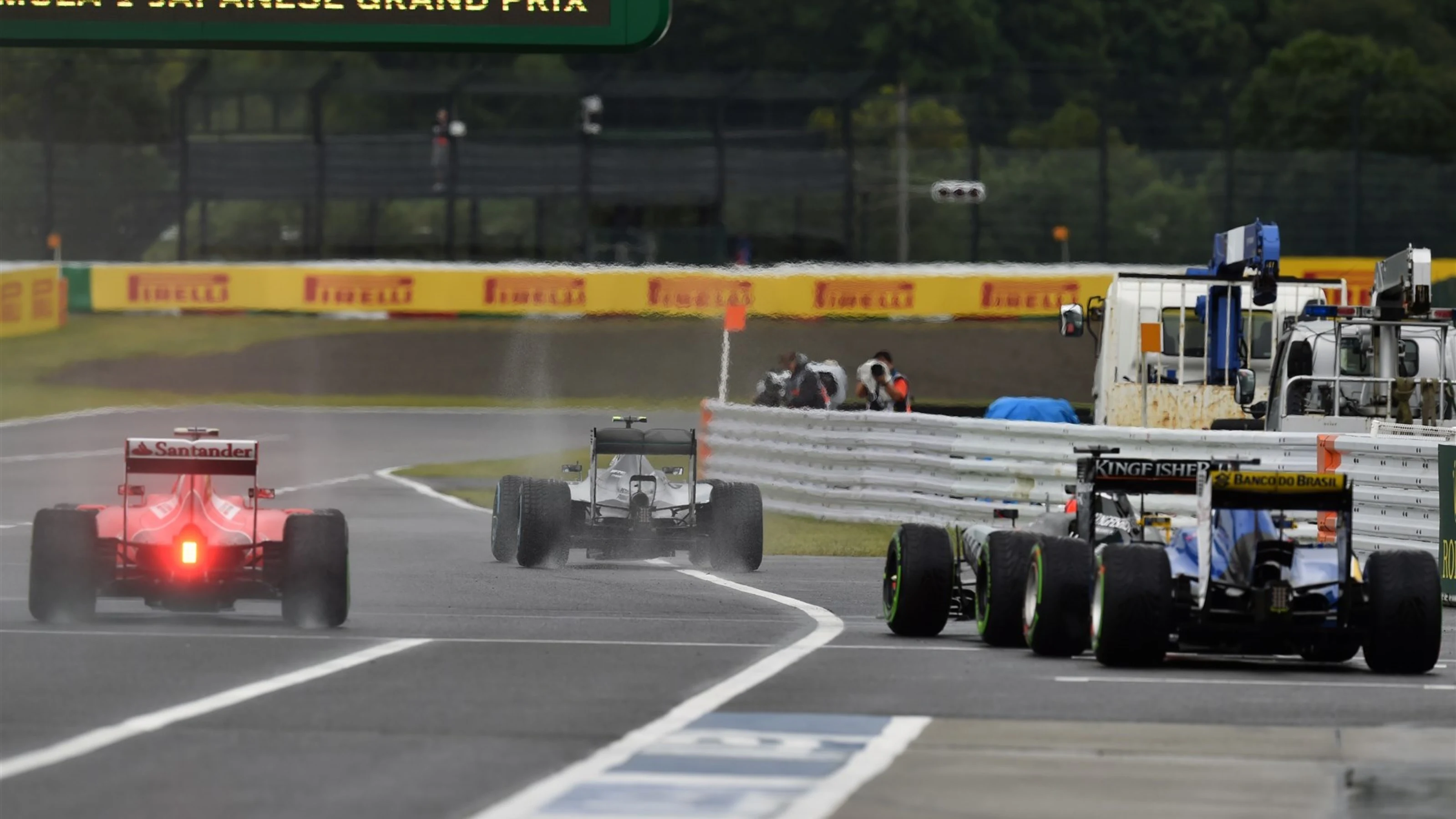 Cars leave pit lane at Formula One World Championship, Rd14, Japanese Grand Prix, Practice, Suzuka,