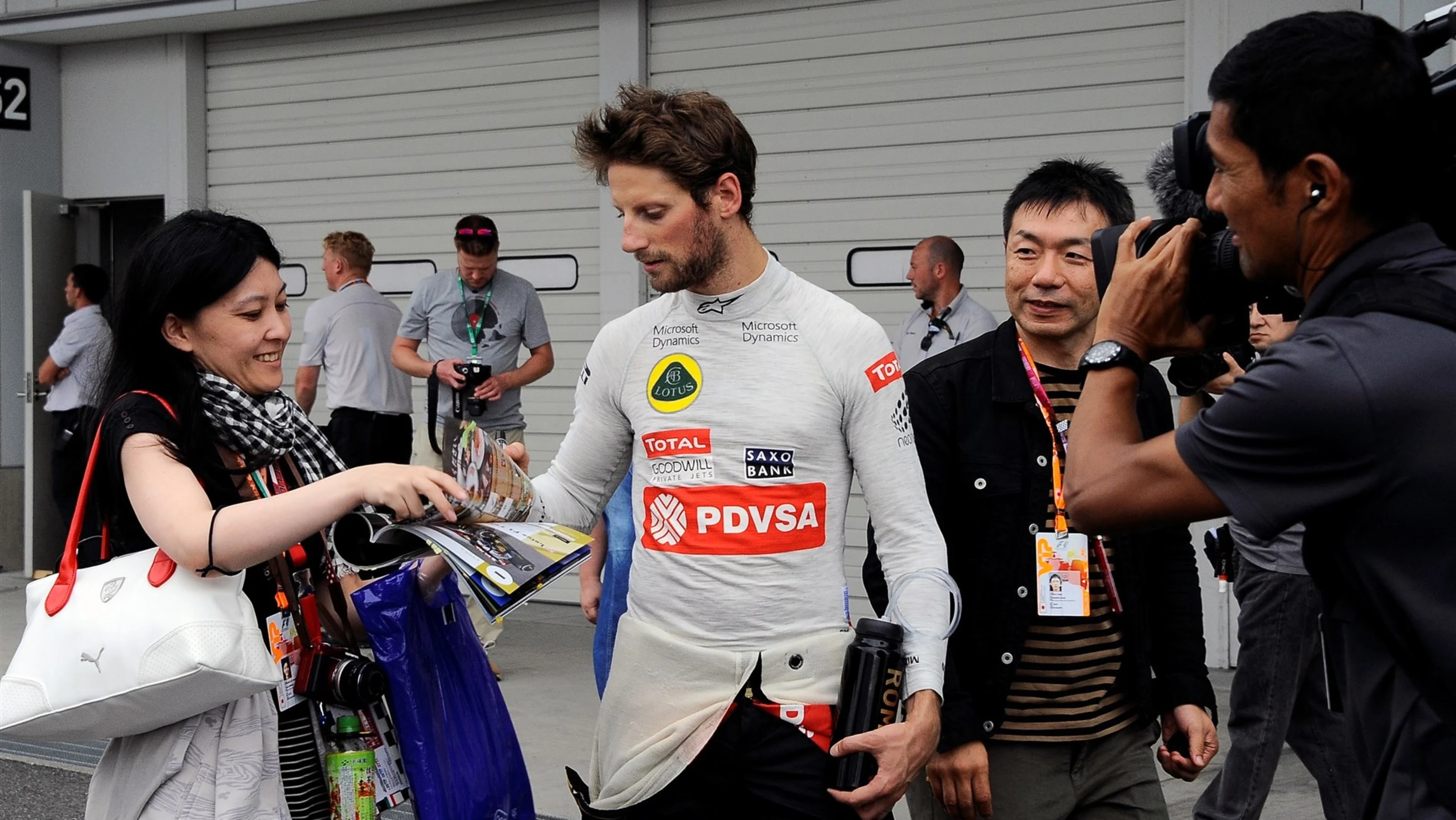 Romain Grosjean (FRA) Lotus F1 signs autographs for the fans at Formula One World Championship,