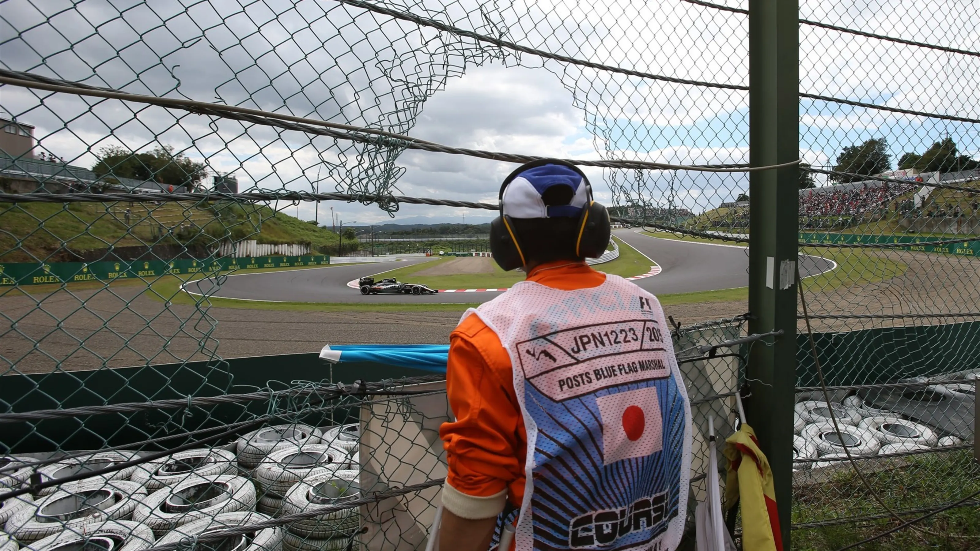 Marshal watches Sergio Perez (MEX) Force India VJM08 at Formula One World Championship, Rd14,