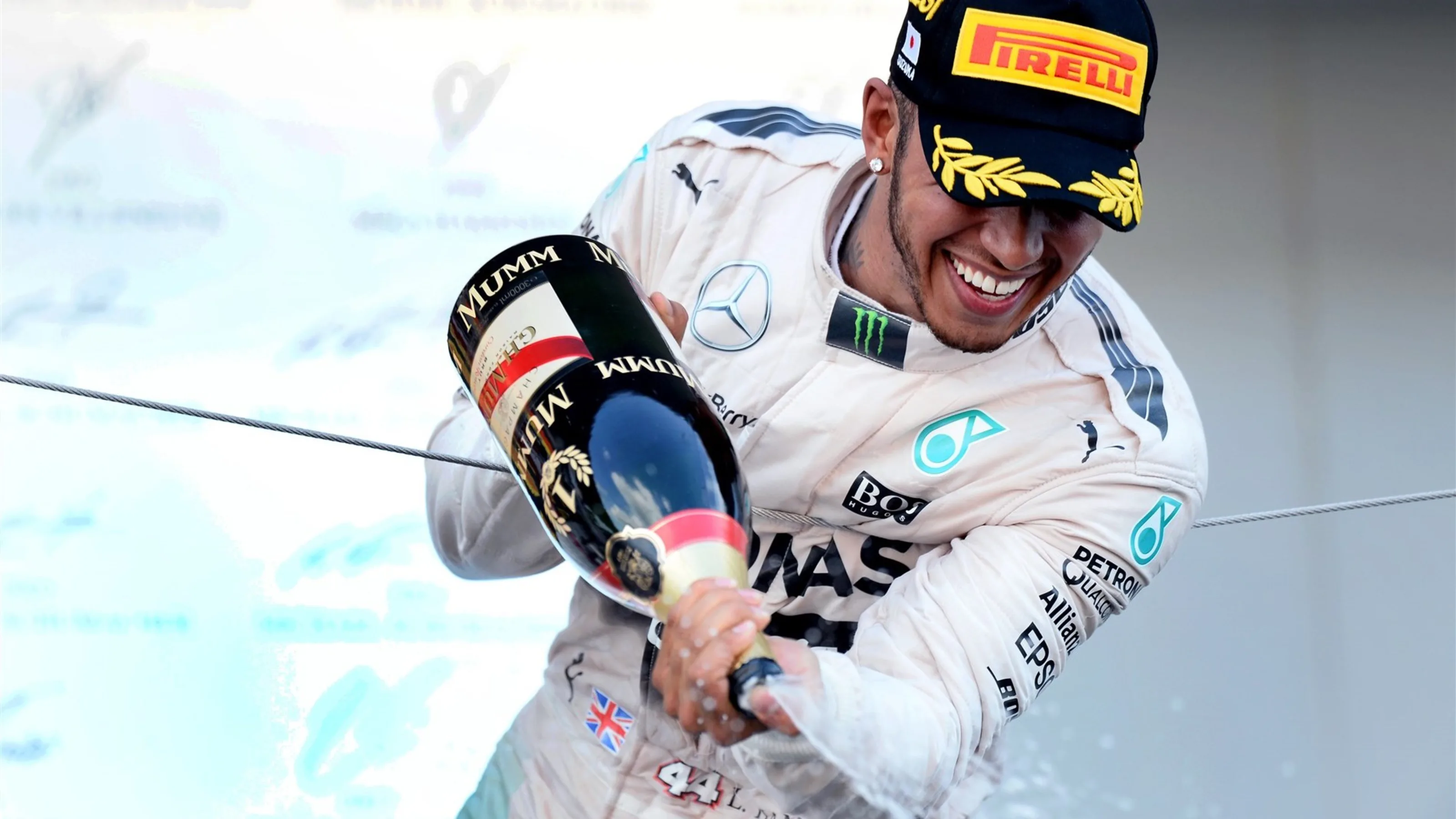 Race winner Lewis Hamilton (GBR) Mercedes AMG F1 celebrates on the podium with champagne at Formula