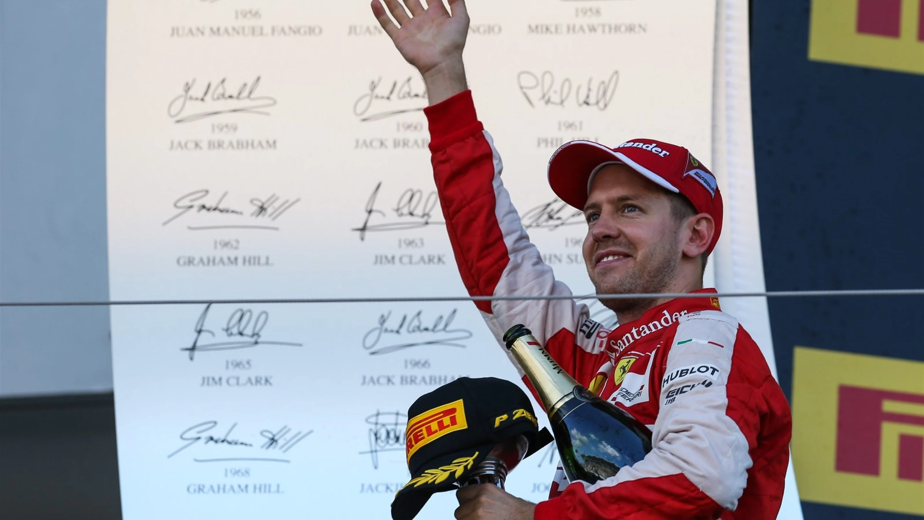 Sebastian Vettel (GER) Ferrari celebrates on the podium at Formula One World Championship, Rd14,