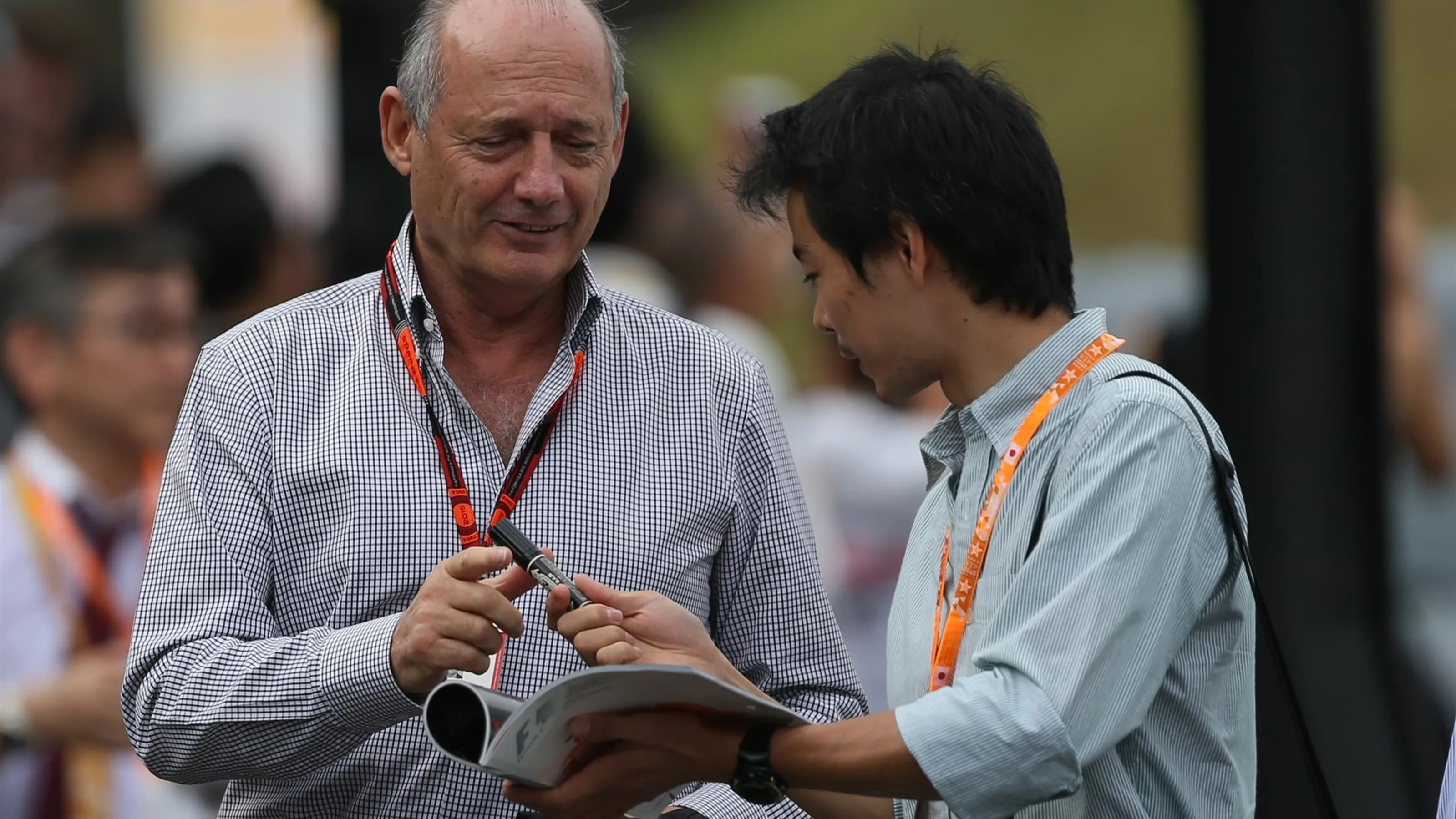 Ron Dennis (GBR) McLaren Executive Chairman signs autographs for the fans at Formula One World