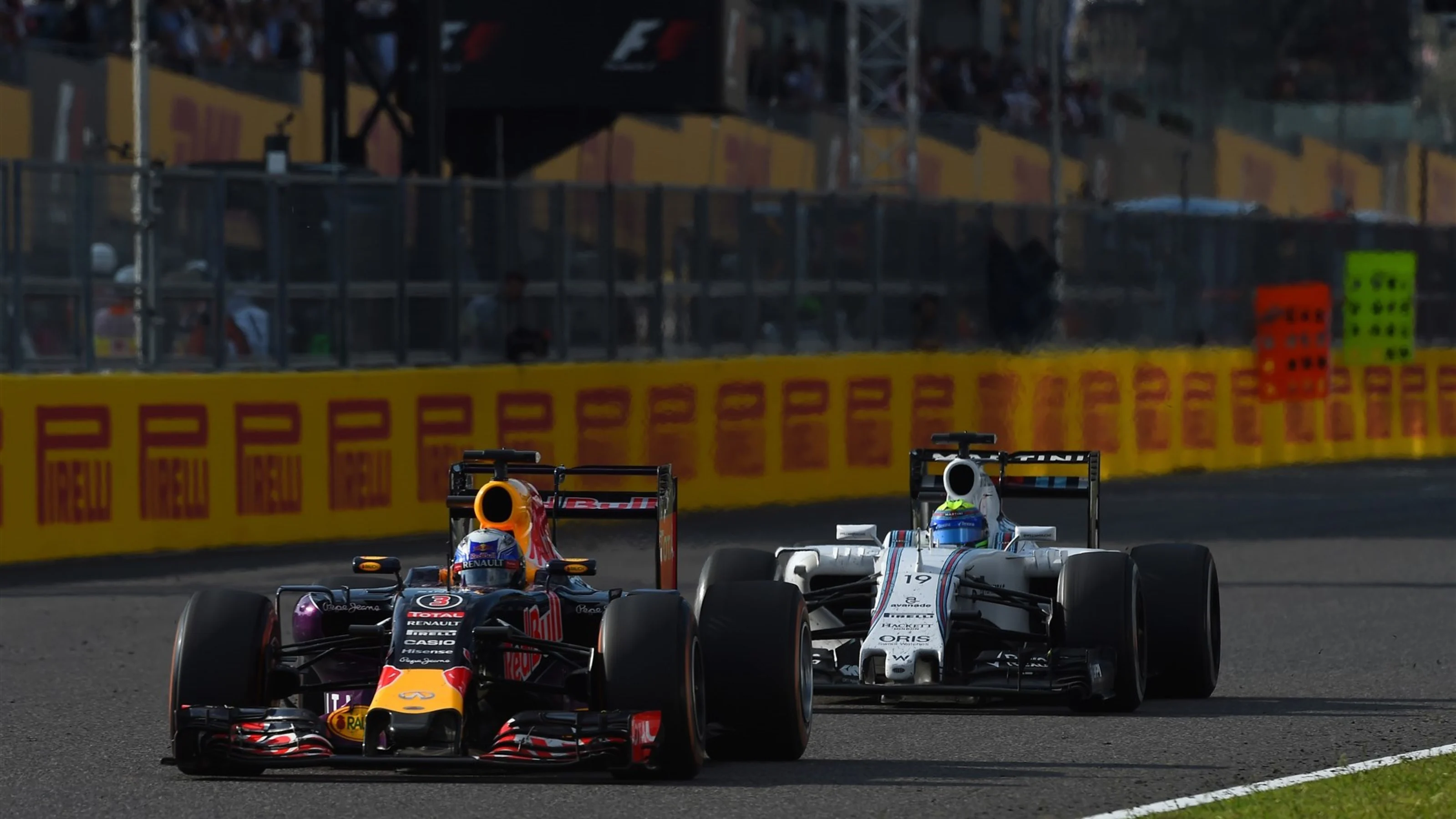 Daniel Ricciardo (AUS) Red Bull Racing RB11 and Felipe Massa (BRA) Williams FW37 at Formula One
