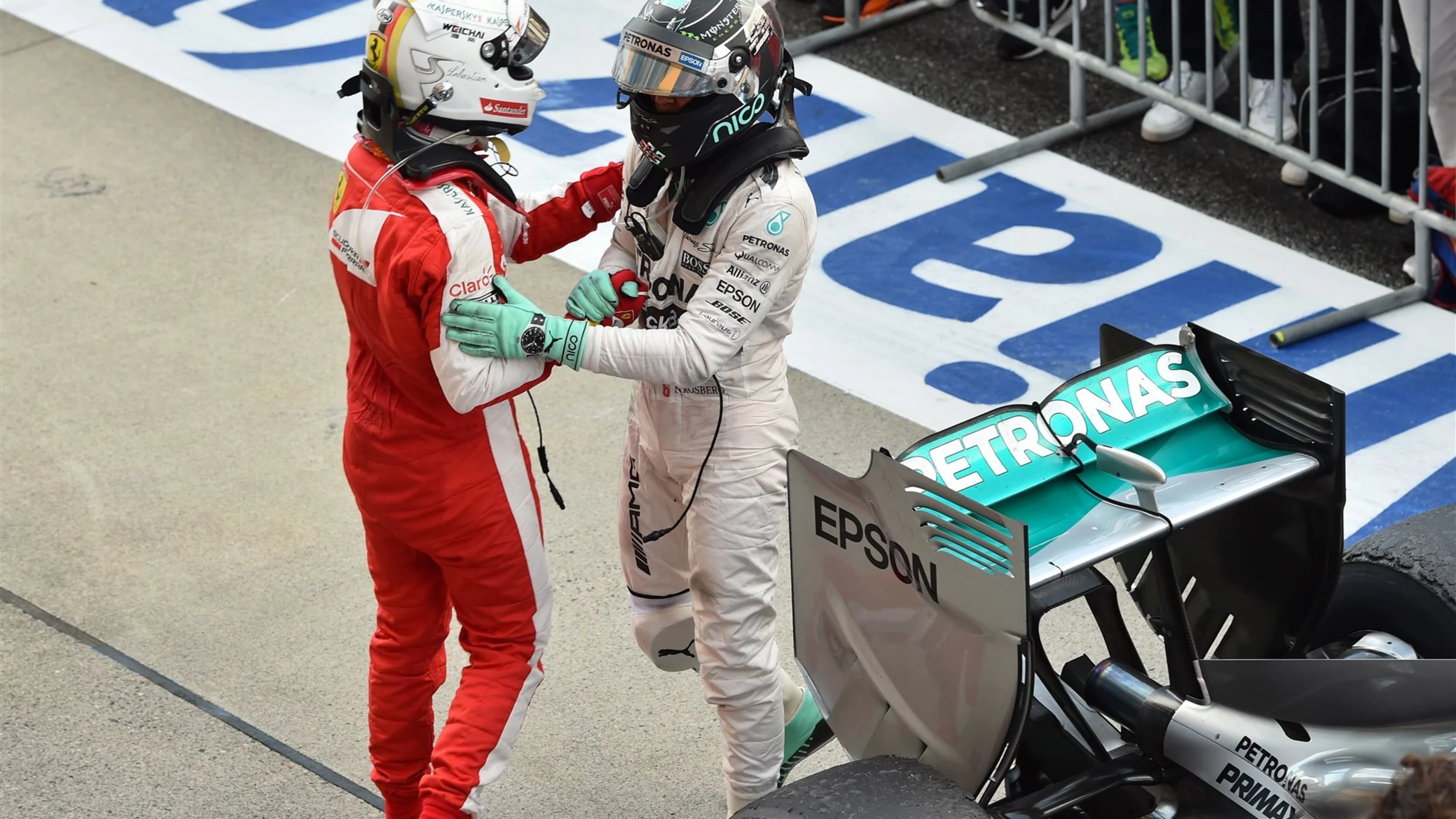 Sebastian Vettel (GER) Ferrari and Nico Rosberg (GER) Mercedes AMG F1 celebrate in parc ferme at
