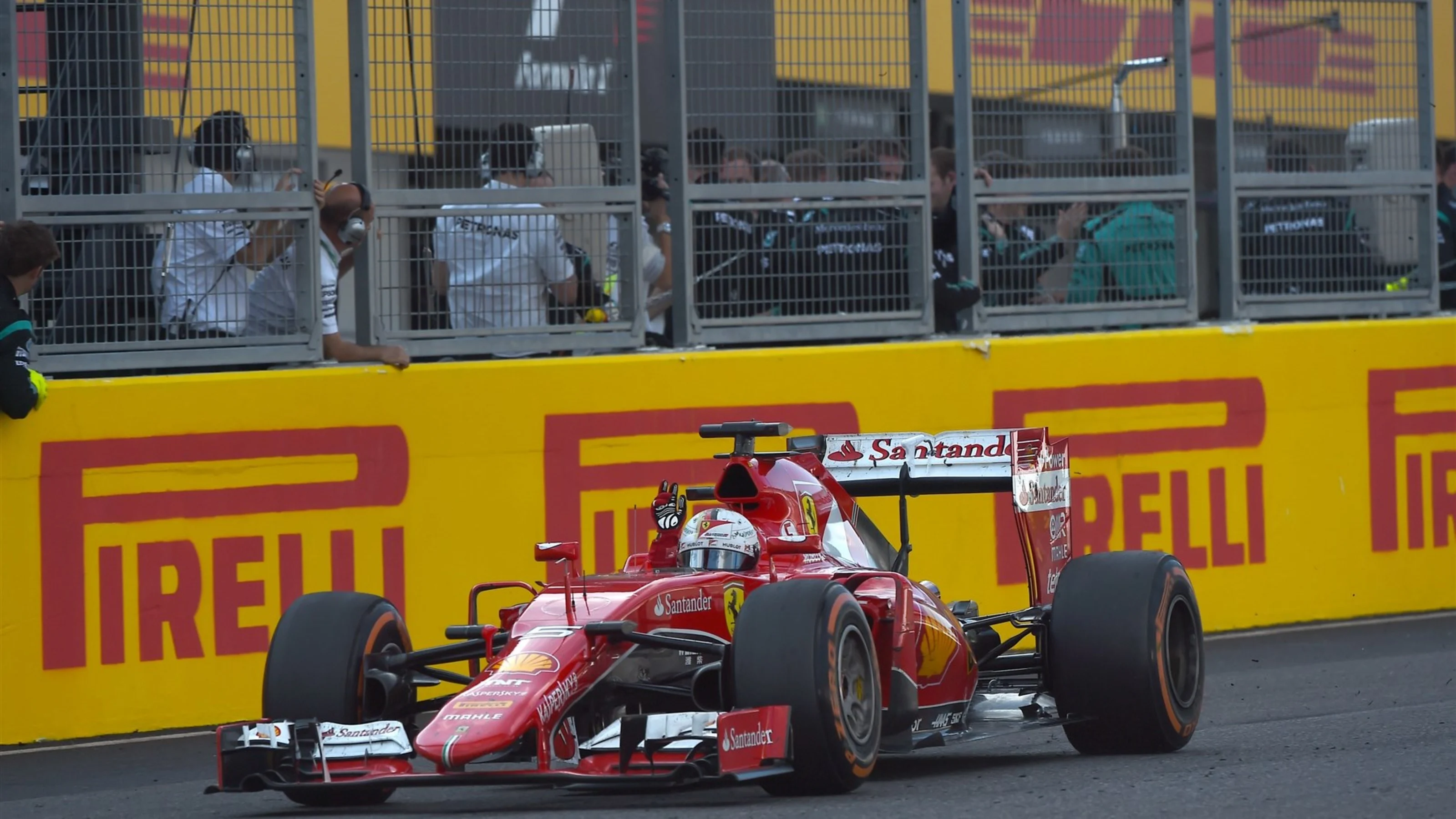 Sebastian Vettel (GER) Ferrari SF15-T crosses the line at Formula One World Championship, Rd14,