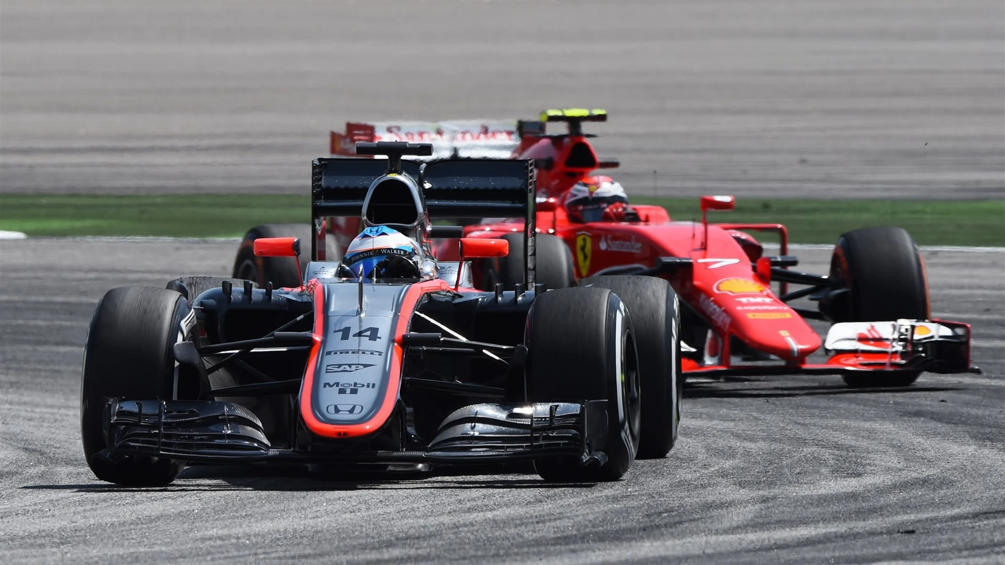Fernando Alonso (ESP) McLaren MP4-30 leads Kimi Raikkonen (FIN) Ferrari SF15-T at Formula One World