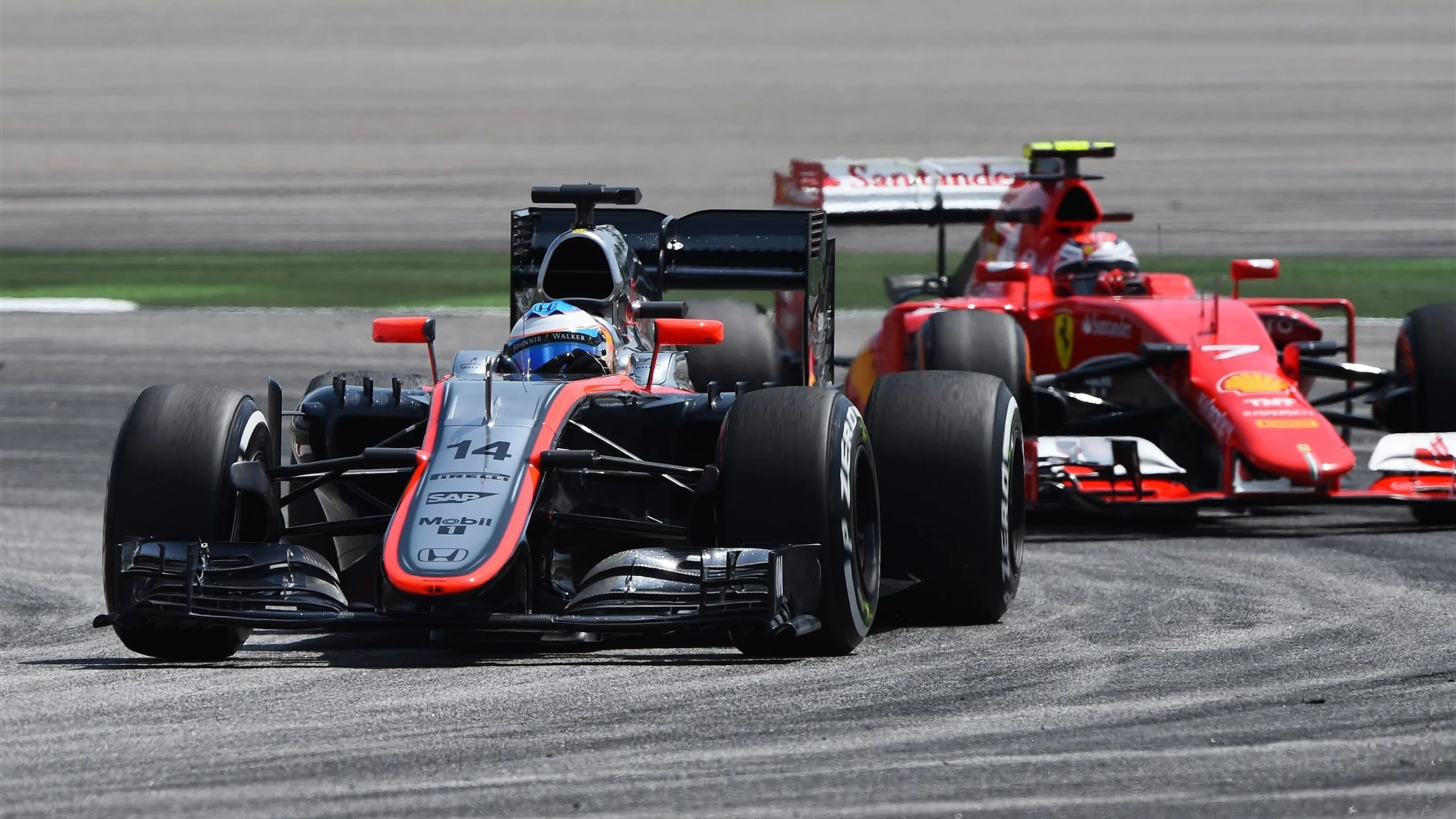 Fernando Alonso (ESP) McLaren MP4-30 leads Kimi Raikkonen (FIN) Ferrari SF15-T at Formula One World