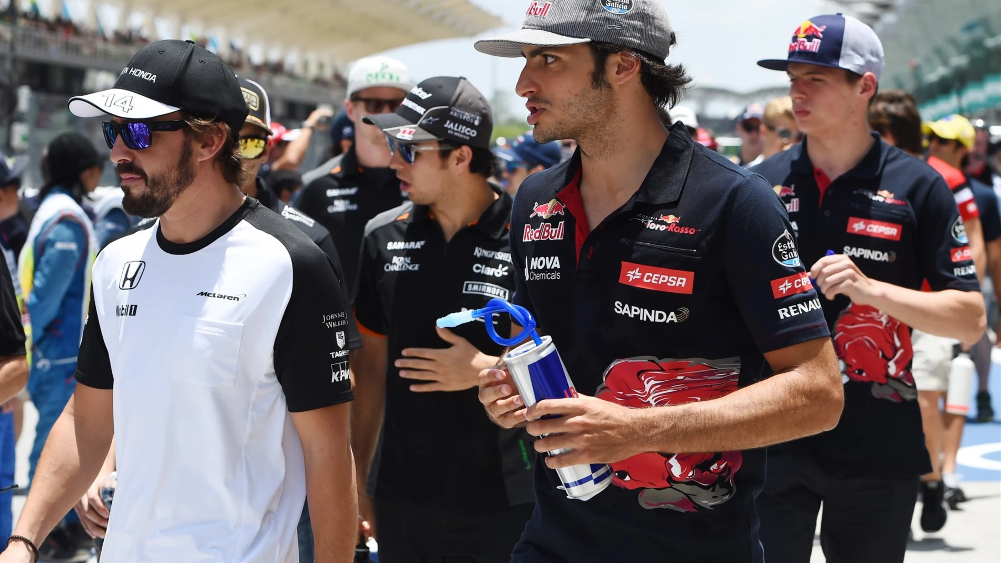 Fernando Alonso (ESP) McLaren and Carlos Sainz jr (ESP) Scuderia Toro Rosso on the drivers parade