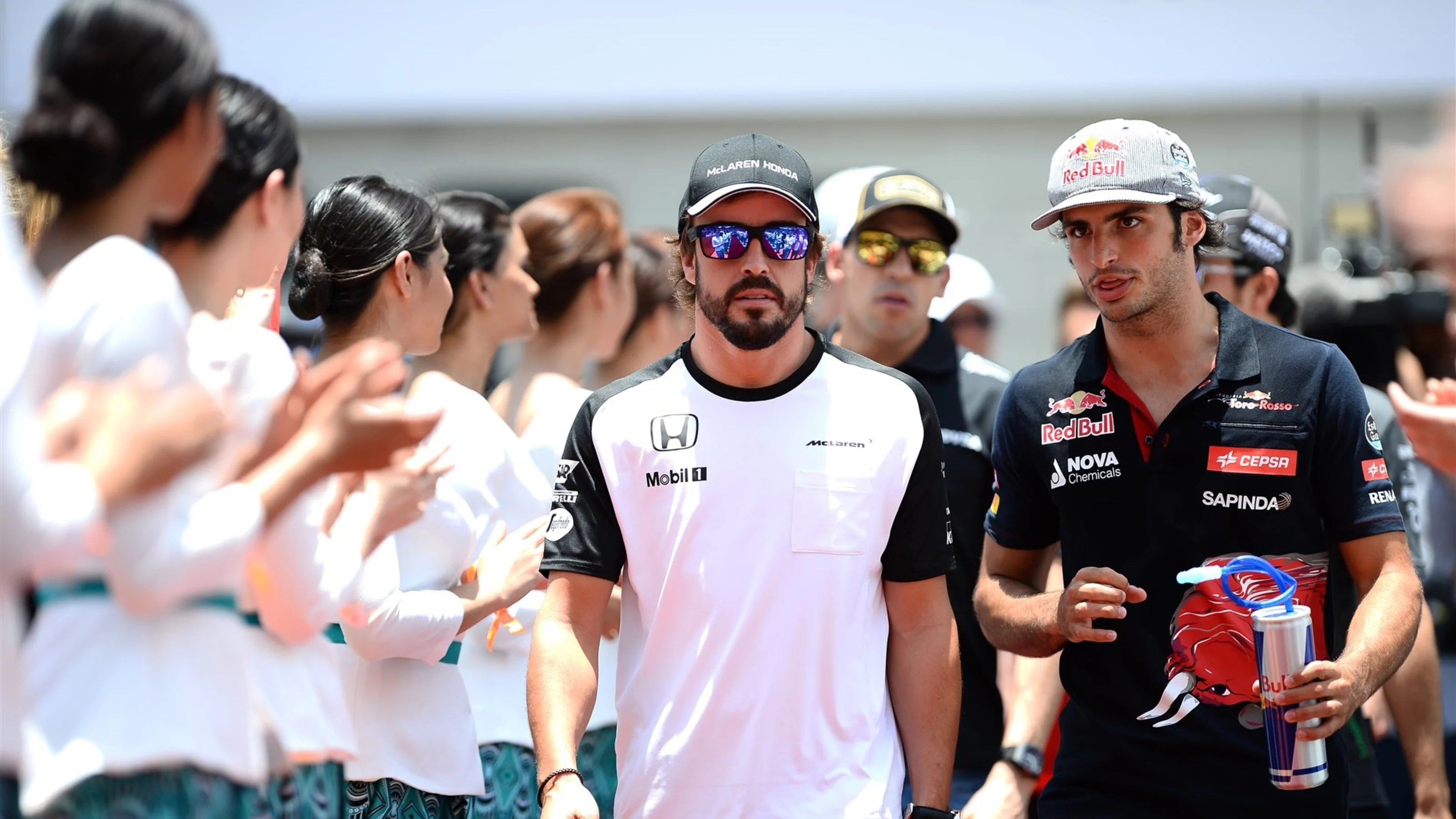 Fernando Alonso (ESP) McLaren and Carlos Sainz jr (ESP) Scuderia Toro Rosso on the drivers parade