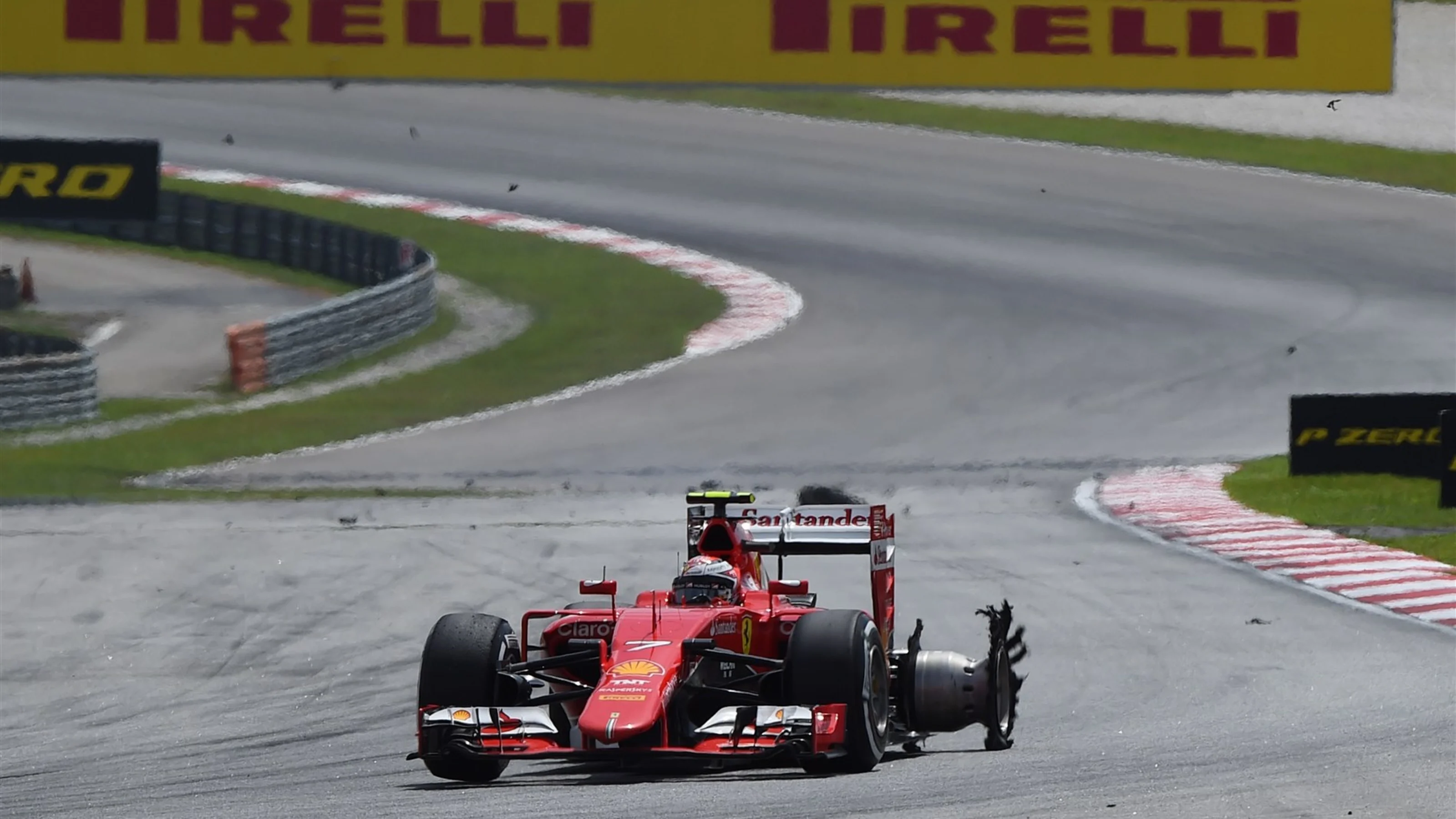 Kimi Raikkonen (FIN) Ferrari SF15-T with puncture at Formula One World Championship, Rd2, Malaysian