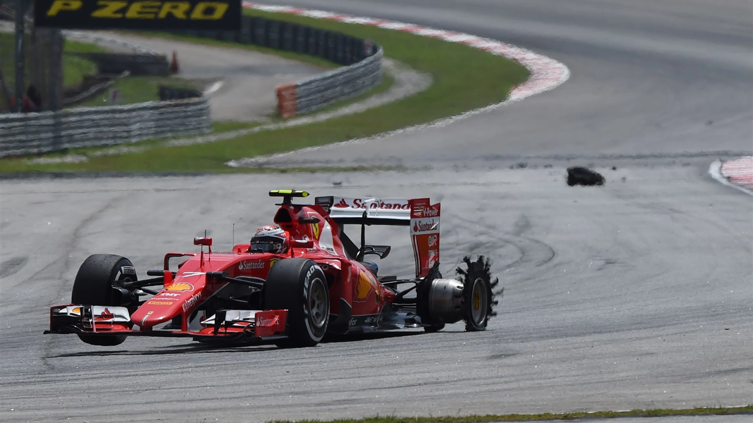 Kimi Raikkonen (FIN) Ferrari SF15-T with puncture at Formula One World Championship, Rd2, Malaysian
