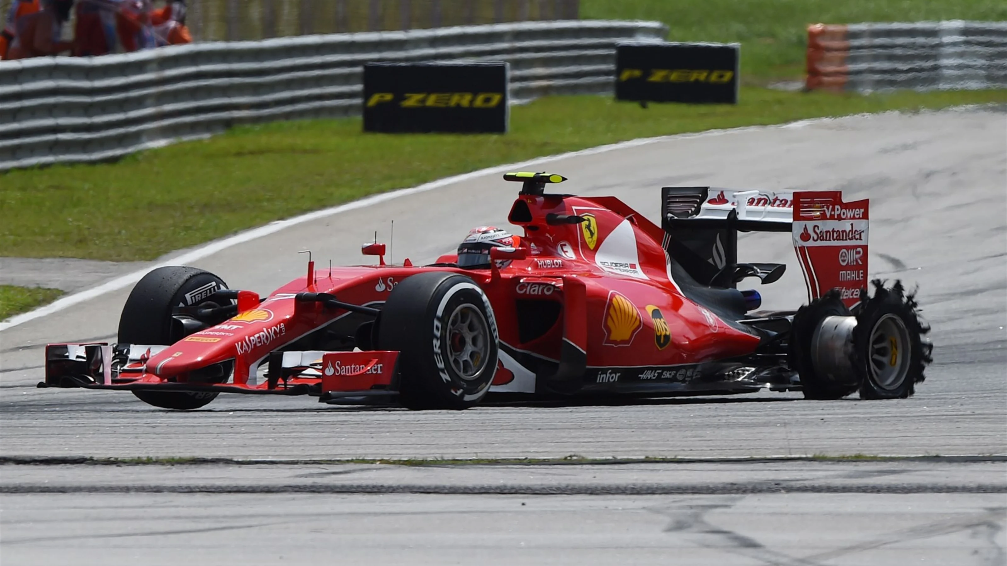 Kimi Raikkonen (FIN) Ferrari SF15-T with puncture at Formula One World Championship, Rd2, Malaysian