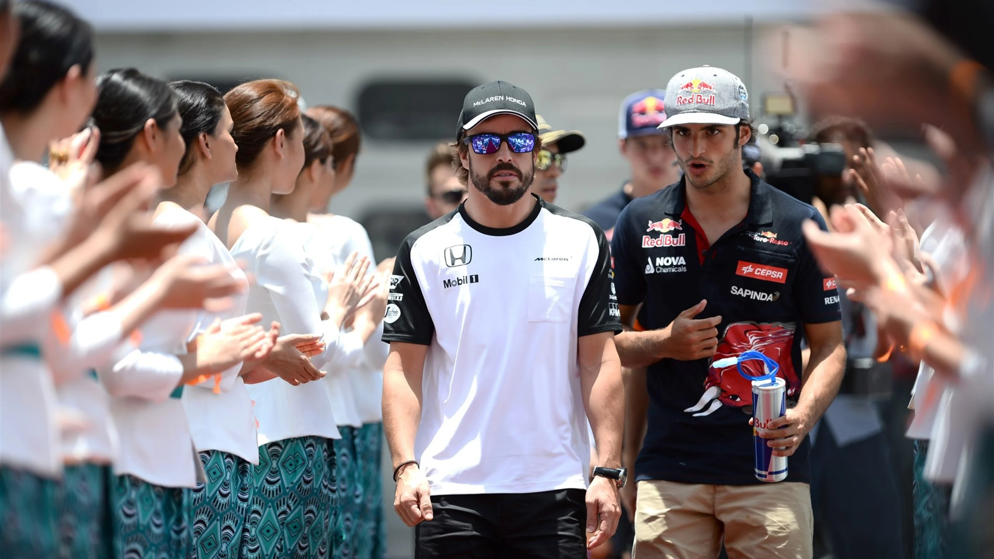 Fernando Alonso (ESP) McLaren and Carlos Sainz jr (ESP) Scuderia Toro Rosso on the drivers parade