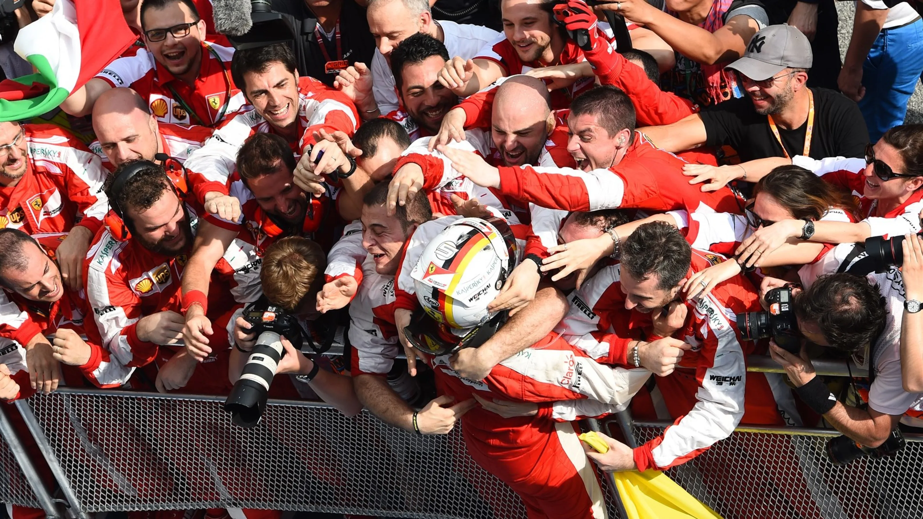 Sebastian Vettel (GER) Ferrari celebrates victory in Parc Ferme at Formula One World Championship,