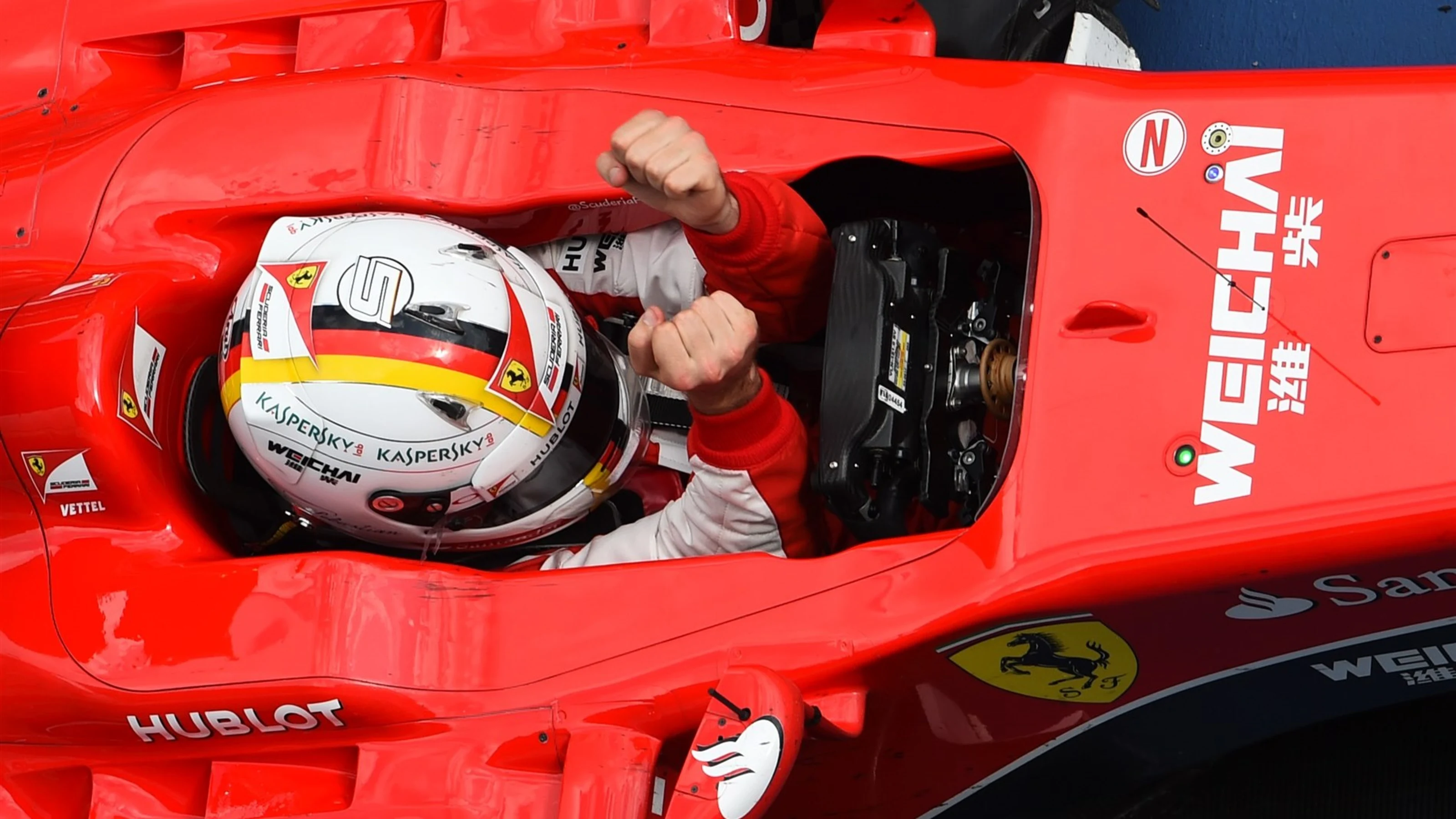 Sebastian Vettel (GER) Ferrari celebrates victory in Parc Ferme at Formula One World Championship,