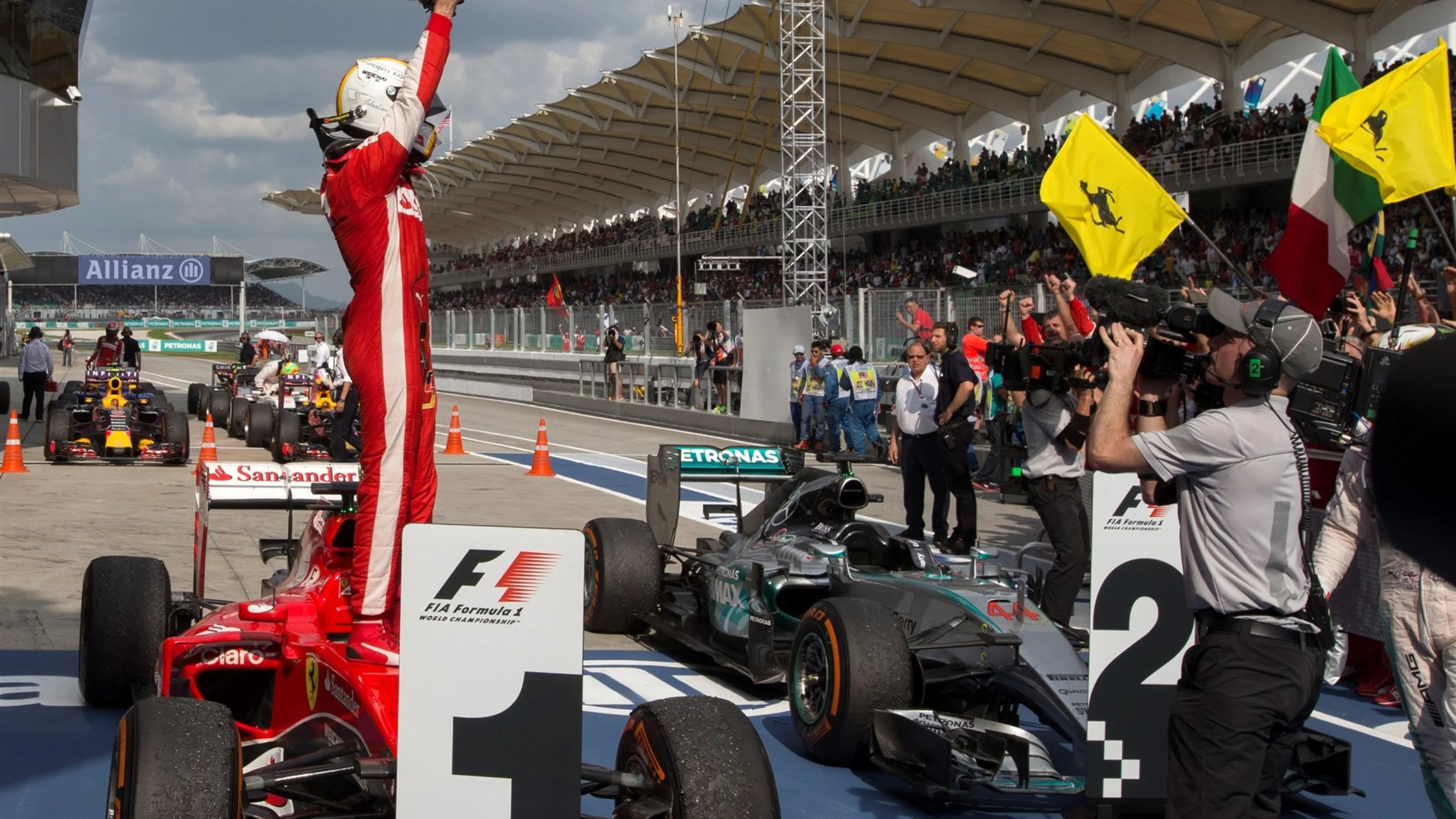 Race winner Sebastian Vettel (GER) Ferrari SF15-T celebrates in parc ferme at Formula One World
