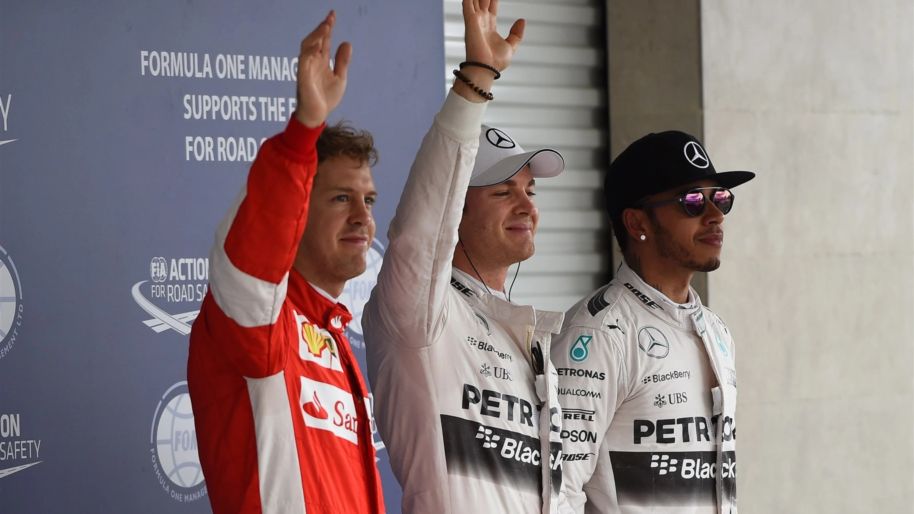 (L to R): Sebastian Vettel (GER) Ferrari, pole sitter Nico Rosberg (GER) Mercedes AMG F1 and Lewis