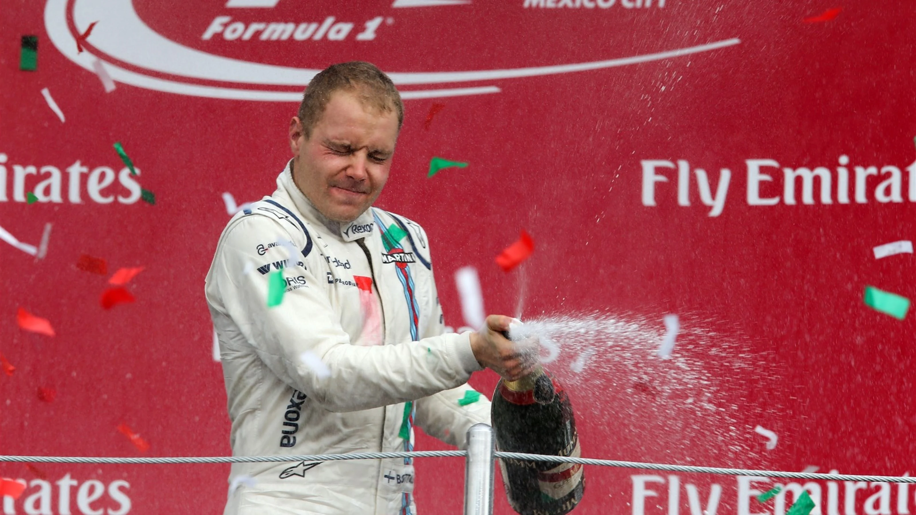 Valtteri Bottas (FIN) Williams FW37 celebrates with the champagne on the podium at Formula One