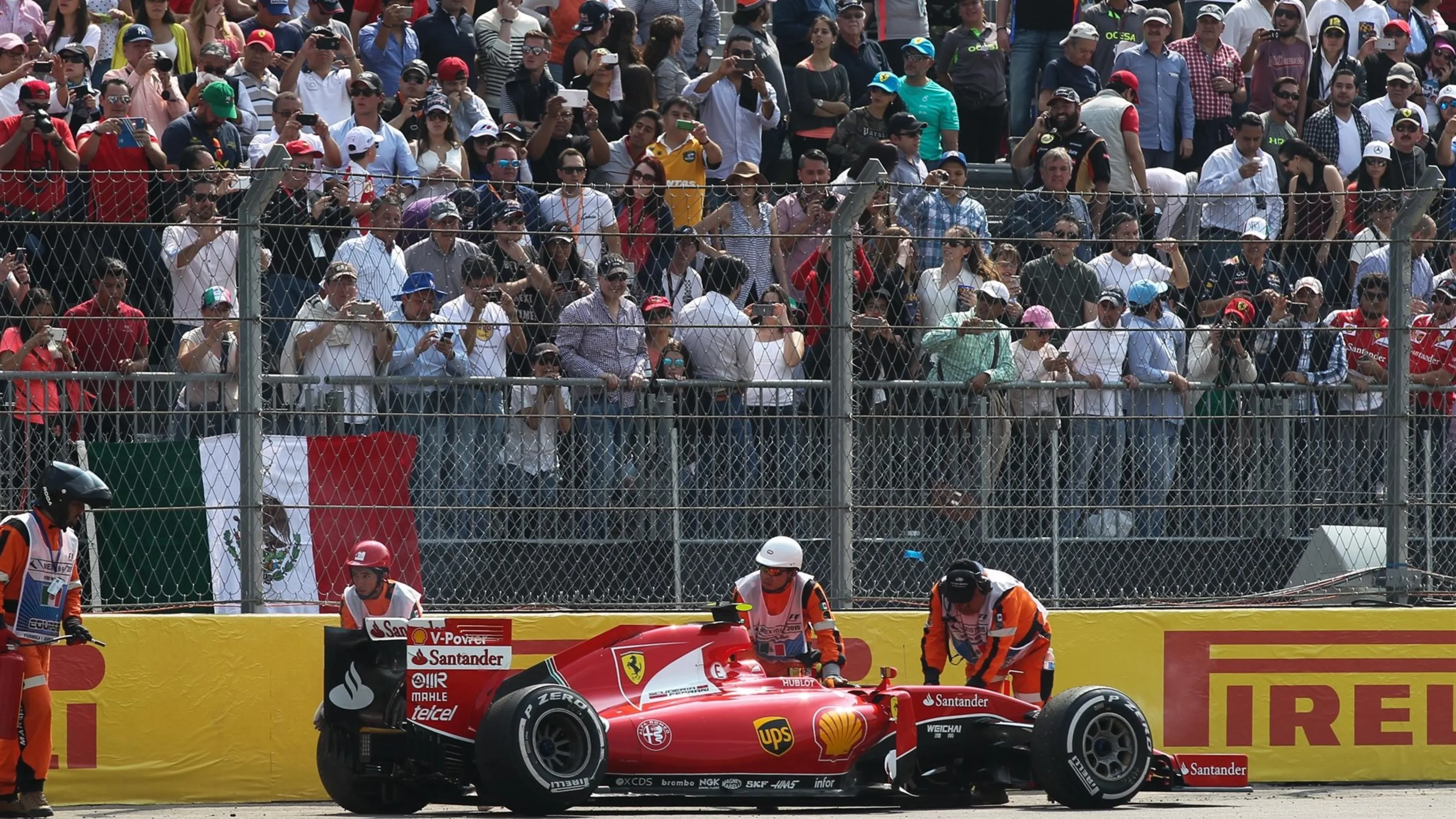 Kimi Raikkonen (FIN) Ferrari SF15-T retires from the race after colliding with Valtteri Bottas