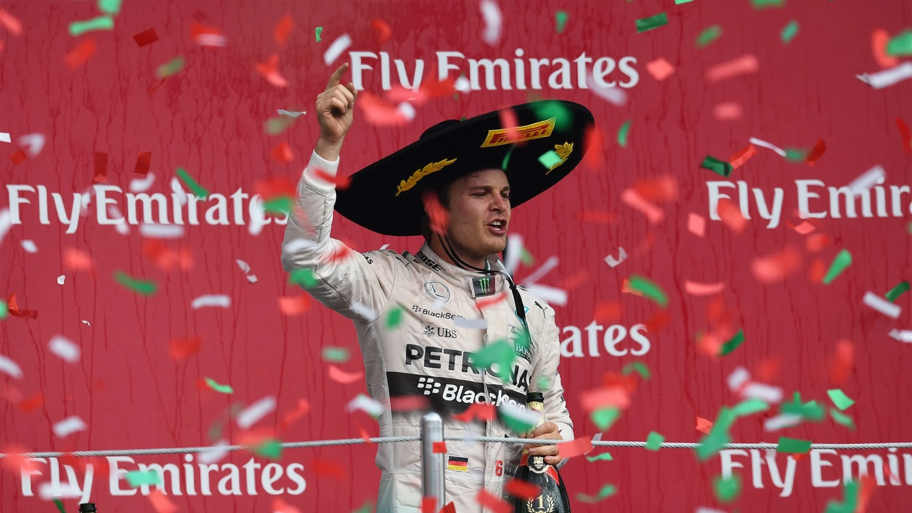 Race winner Nico Rosberg (GER) Mercedes AMG F1 celebrates on the podium with the champagne at
